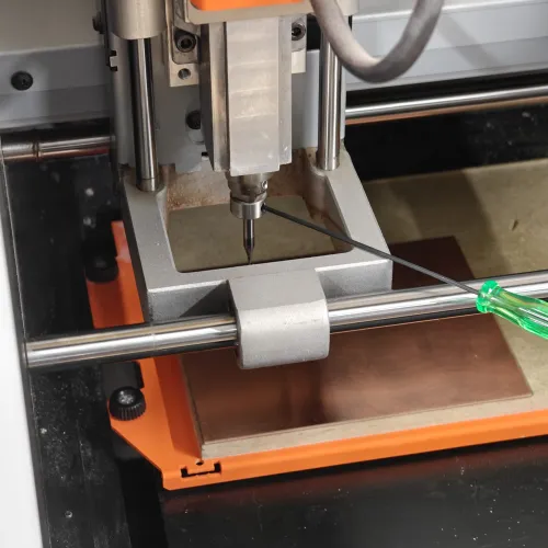 End mill positioned above the copper board at the desired X/Y origin point