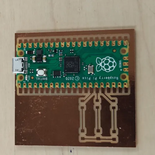 Pi Pico placed on the milled board for test fitment, pads aligned with SMD footprint