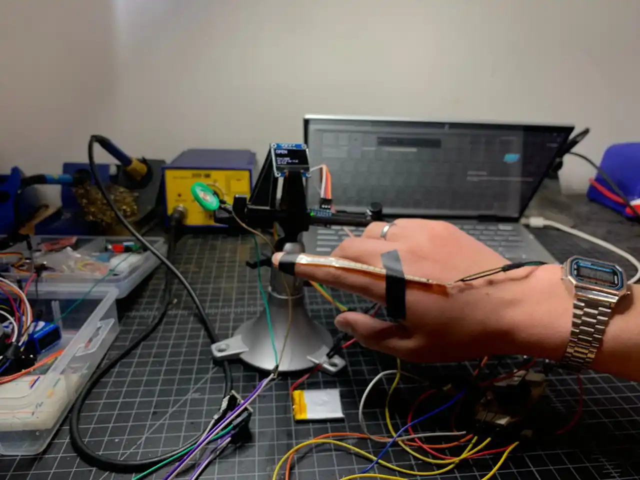 flex sensor taped to finger with full system running