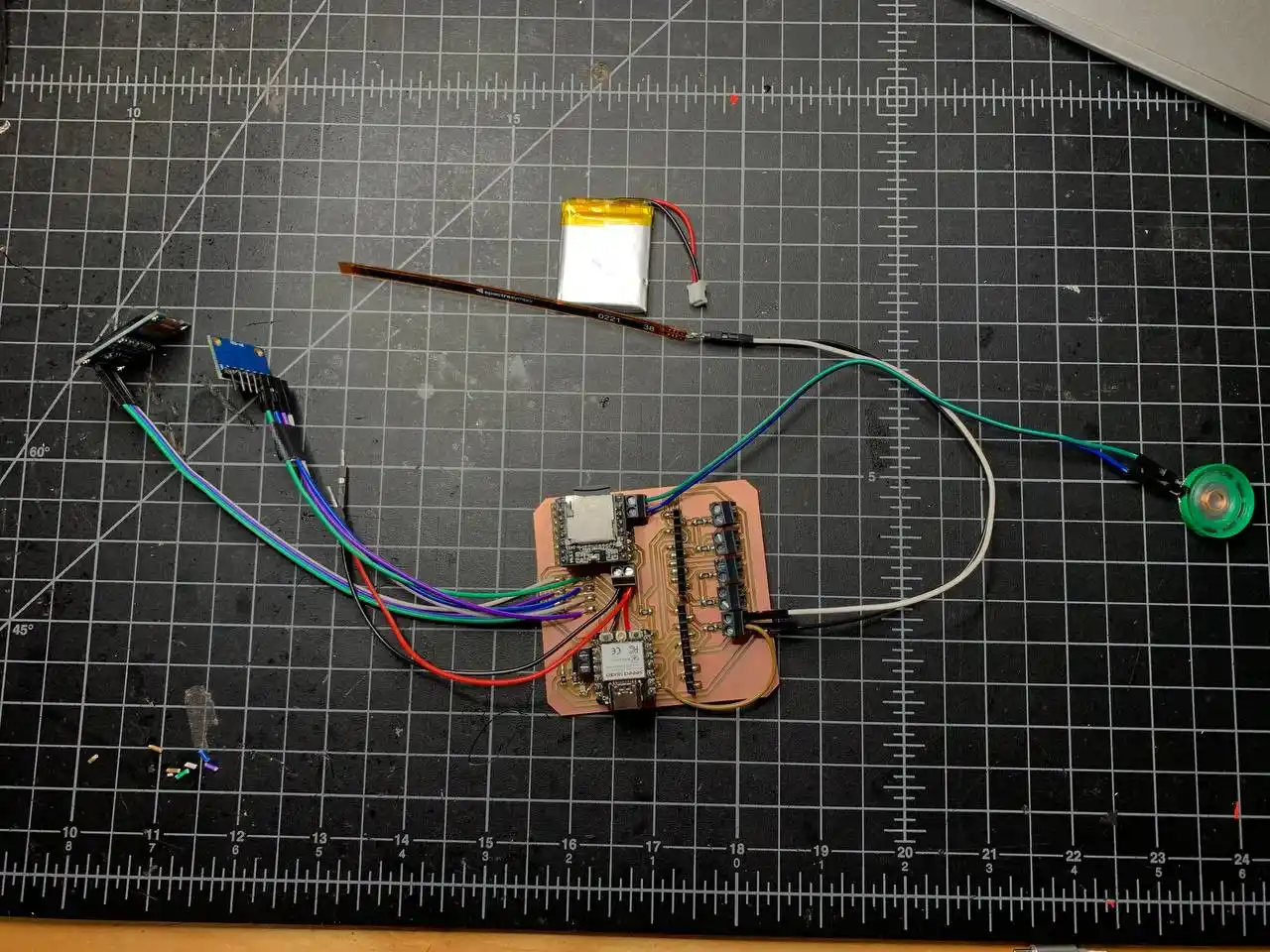 all components wired to the PCB laid out showing MPU6050, OLED, flex sensor, speaker, and LiPo battery all connected