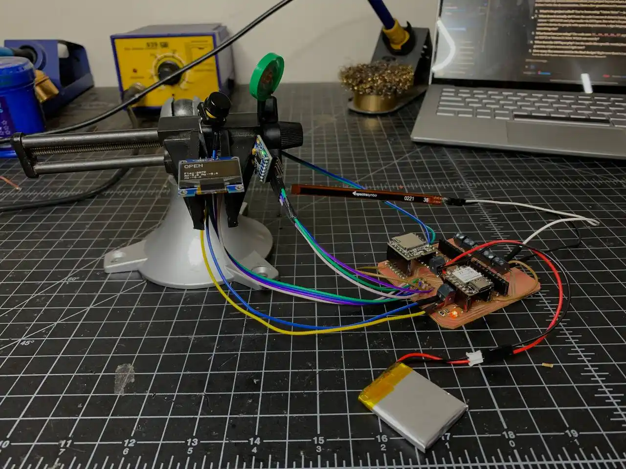 full system running with OLED showing OPEN and live flex and accel values, PCB on bench