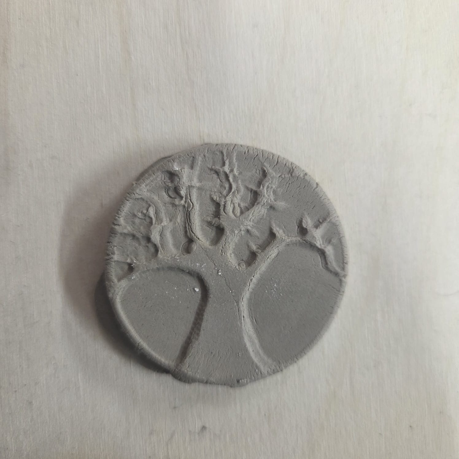 Clay pressed medallion - view 2