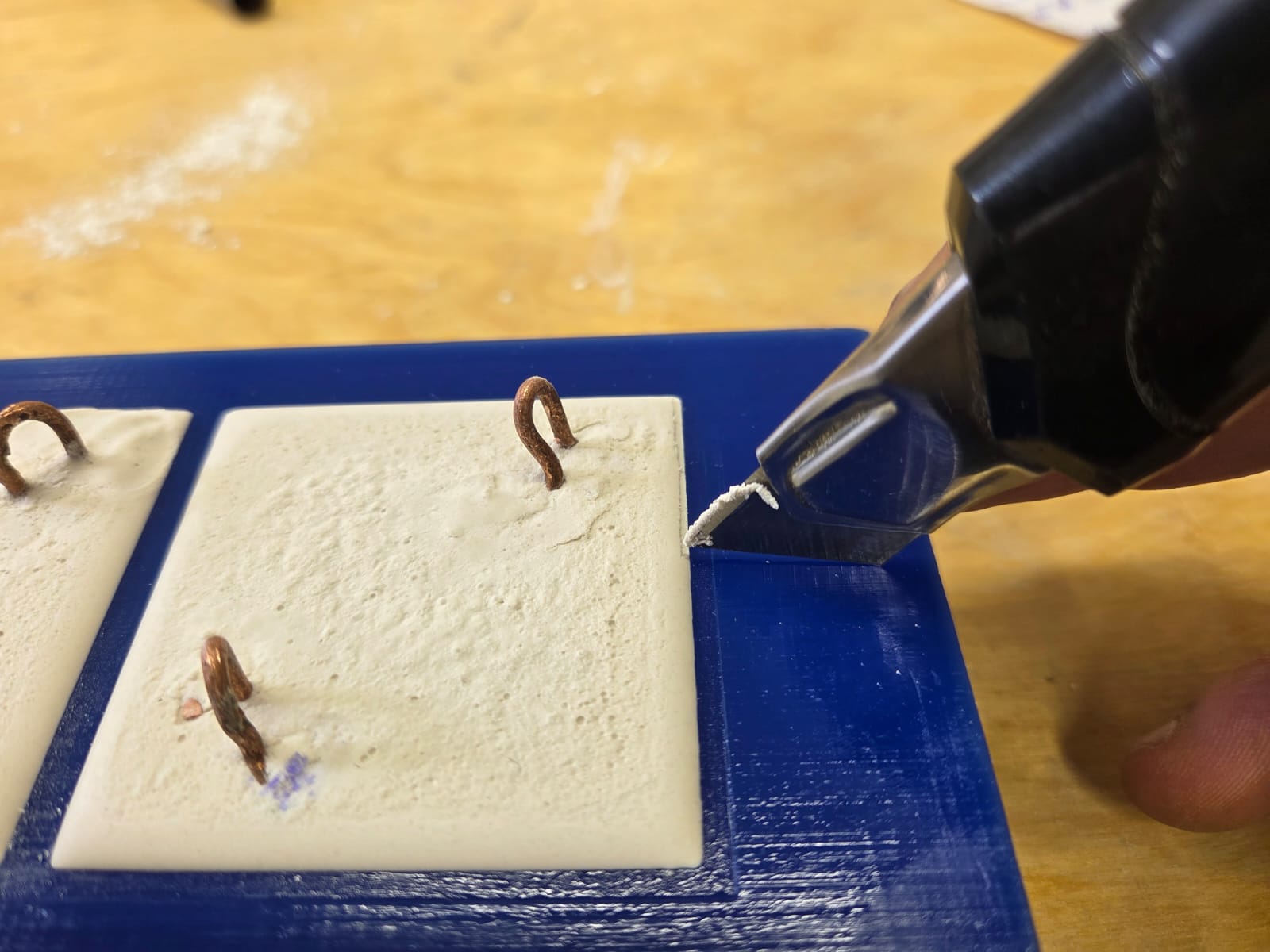 Metal clips embedded in plaster cast