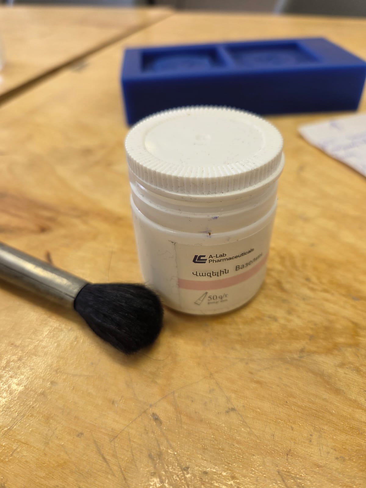 Vaseline and brush for release agent application
