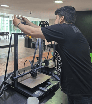 PLA filament being passed through the material sensor