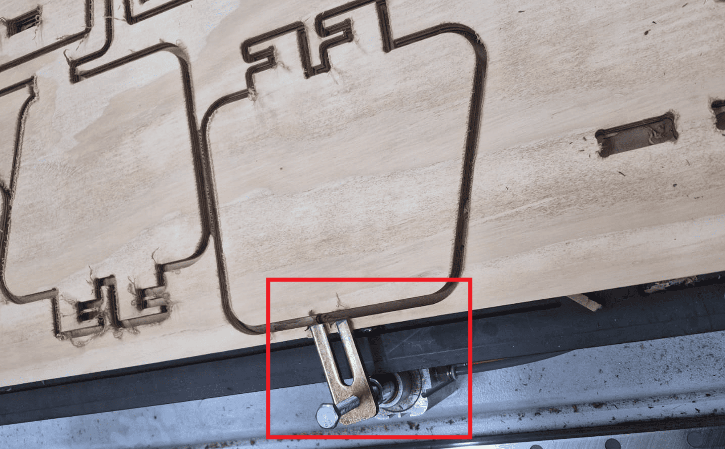 CNC cutting session and clamp repositioning