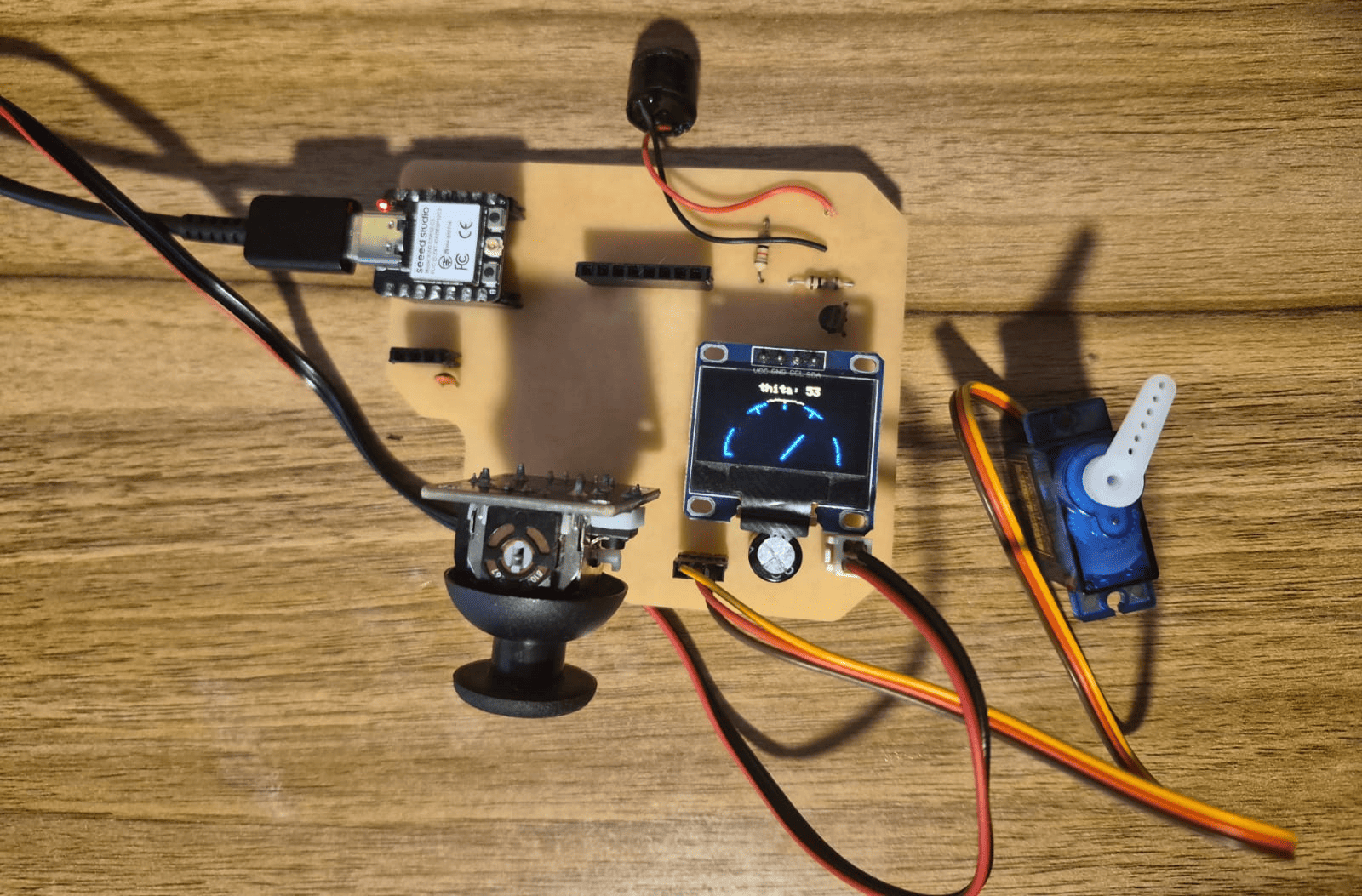 System with servo motor, OLED display and buzzer connected to XIAO ESP32-C3
