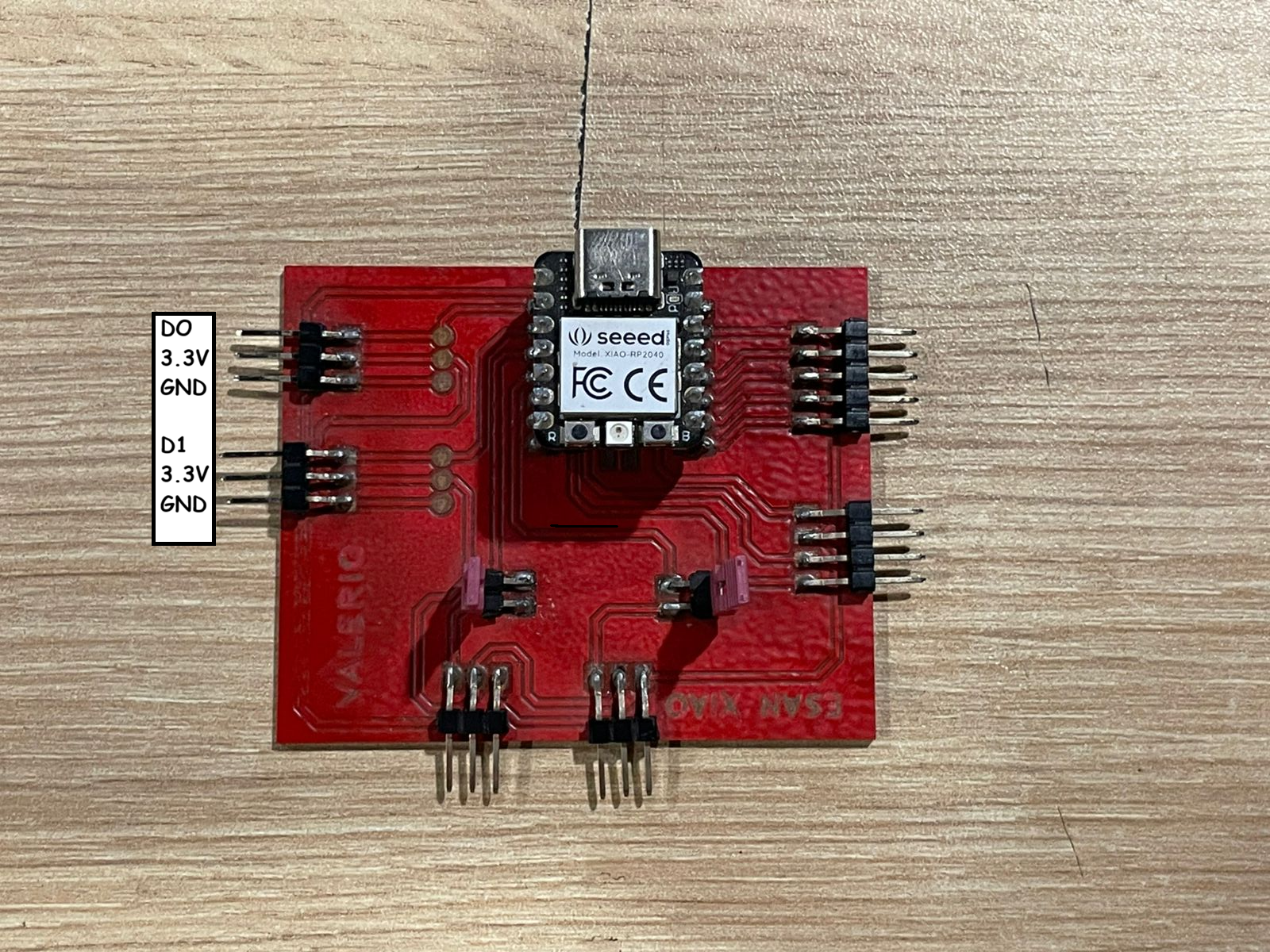 XIAO RP2040 mounted on a red development board
