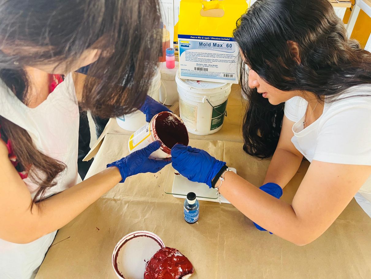 Students pouring Mold Max 60