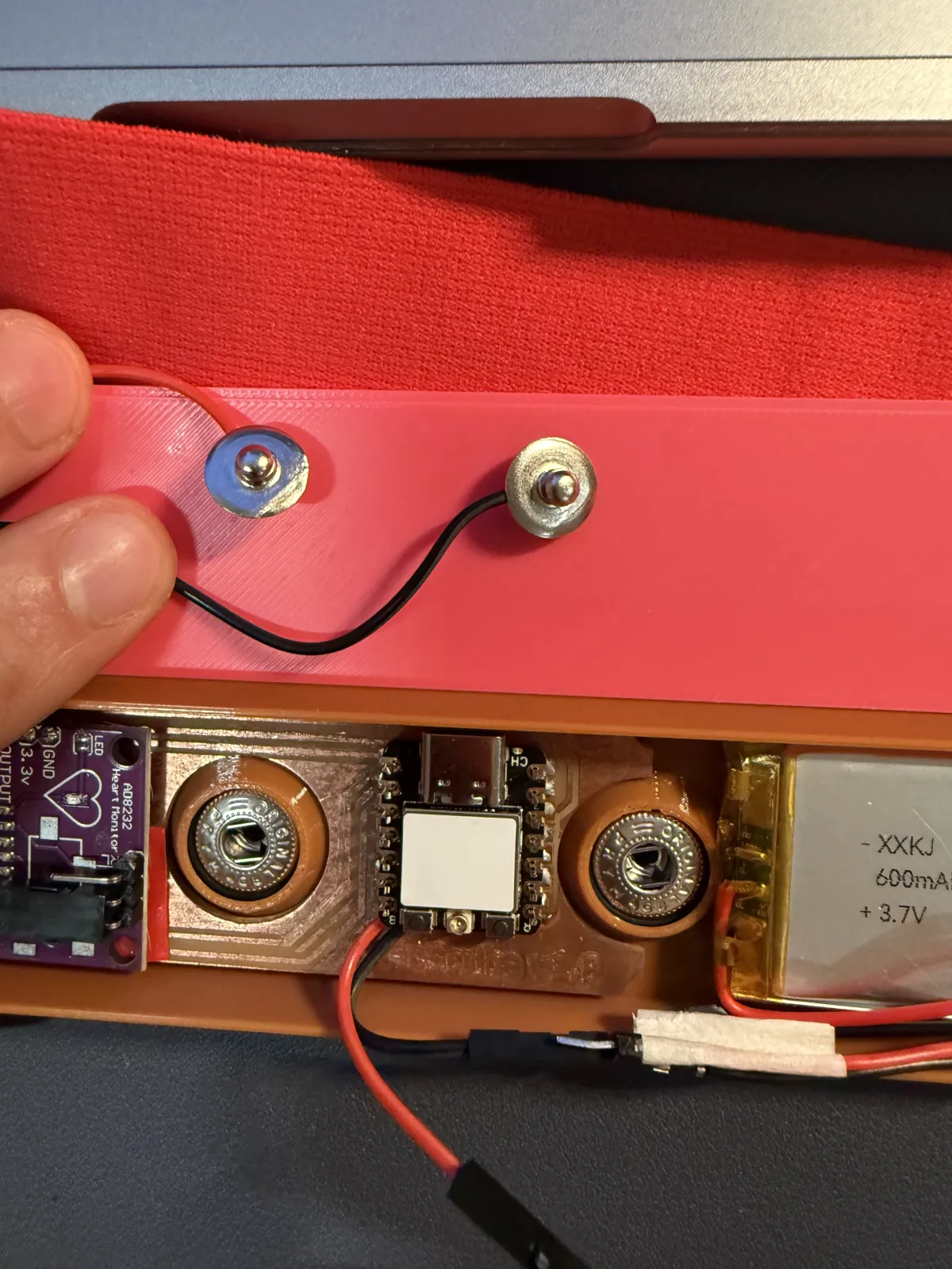 Snap wiring integrated with the carrier PCB and enclosure