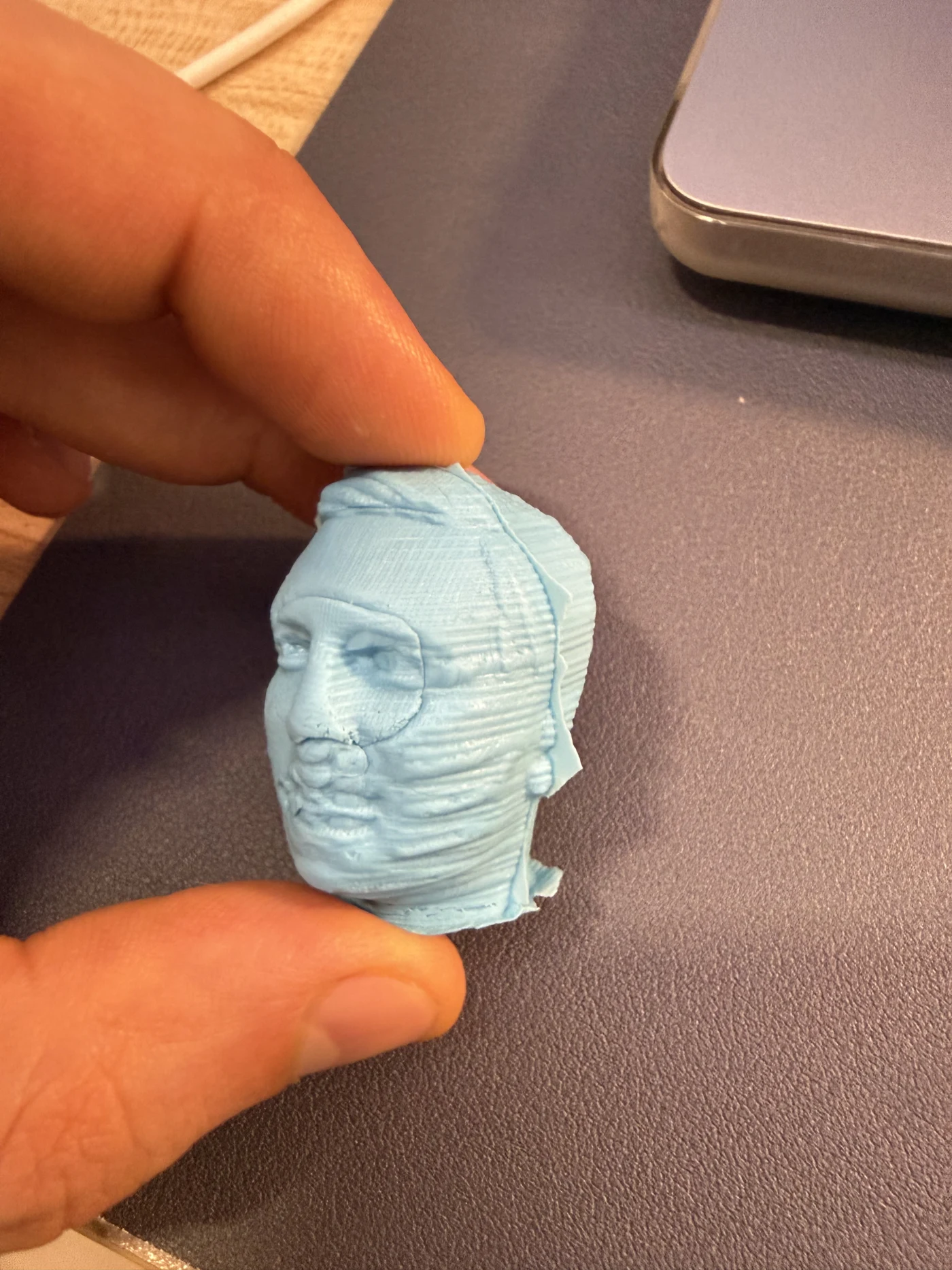Final blue cast face figure made from the milled mould