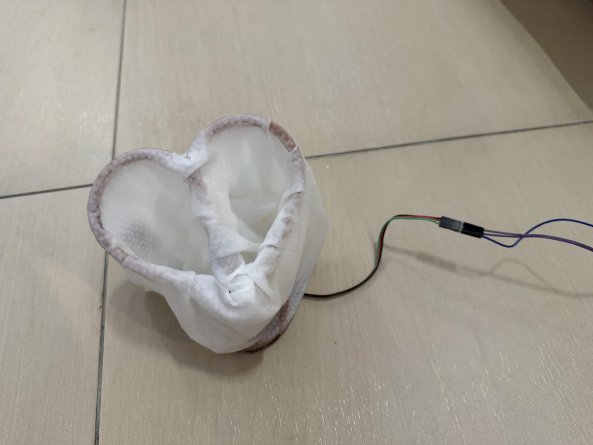 Finished fabric and resin heart lamp with internal light