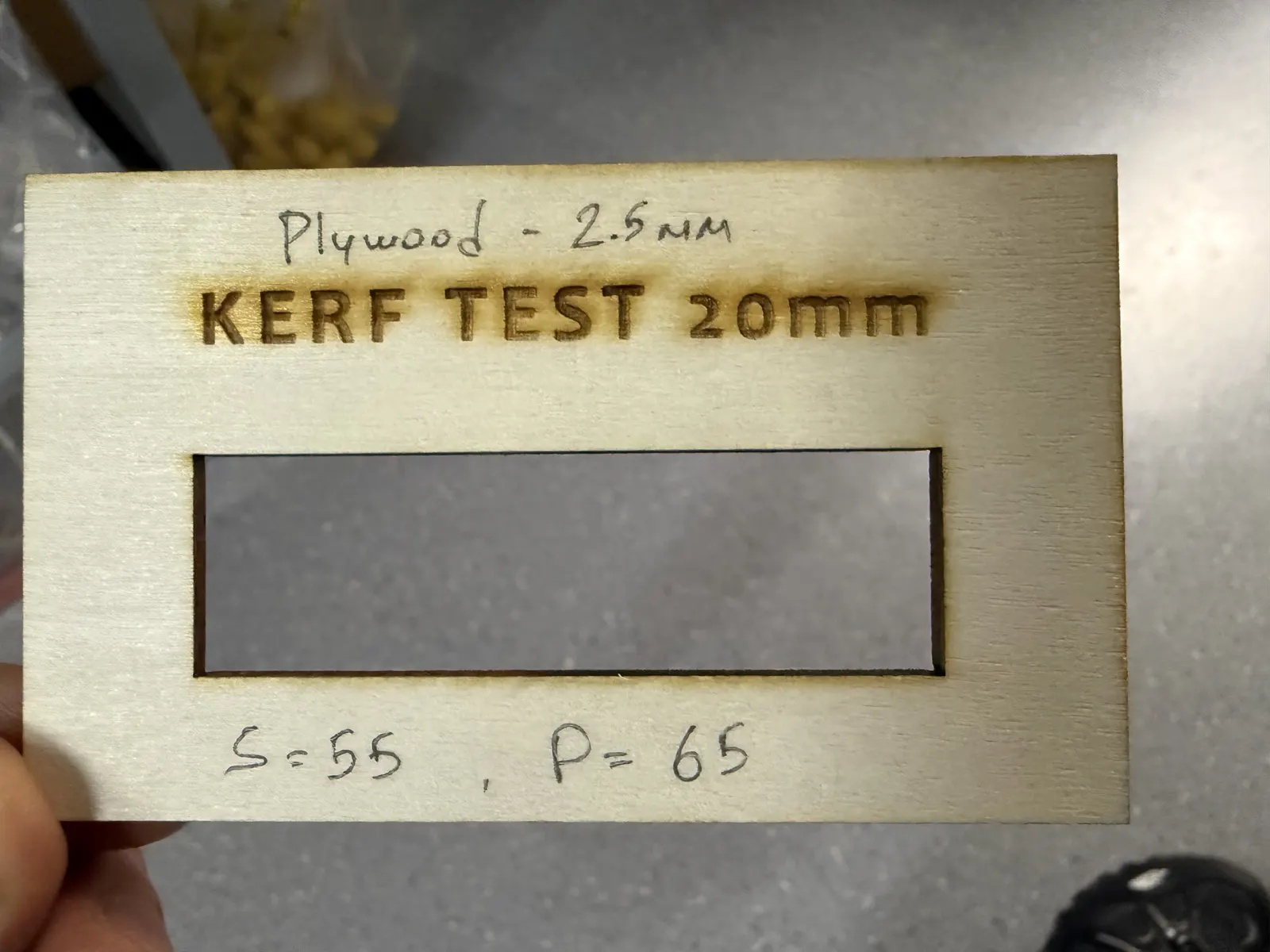 Measured test piece showing 19.2 mm after cutting the 20 mm rectangle