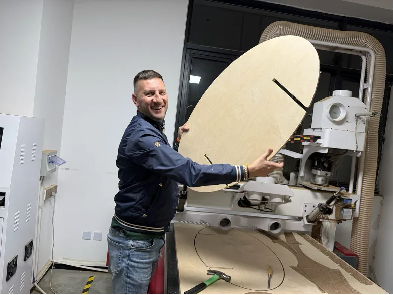 Cut component lifted from the bed