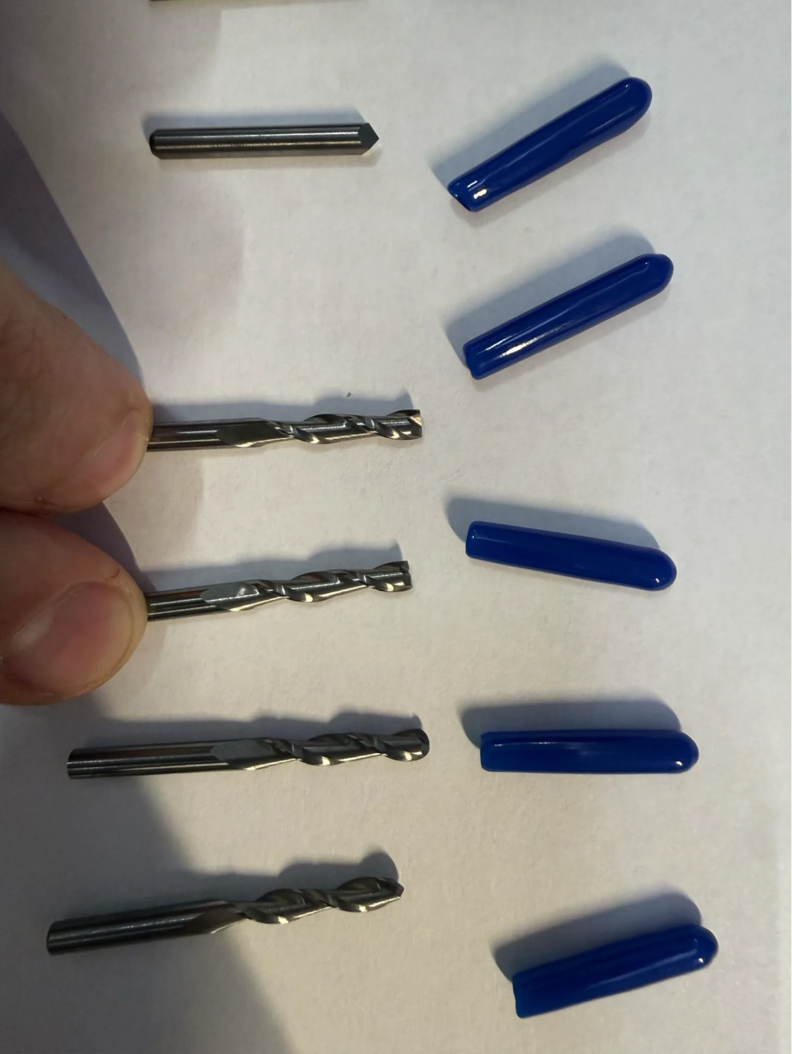 Close-up of the spiral end mills – used for profile cutting and drilling operations on the PCB board