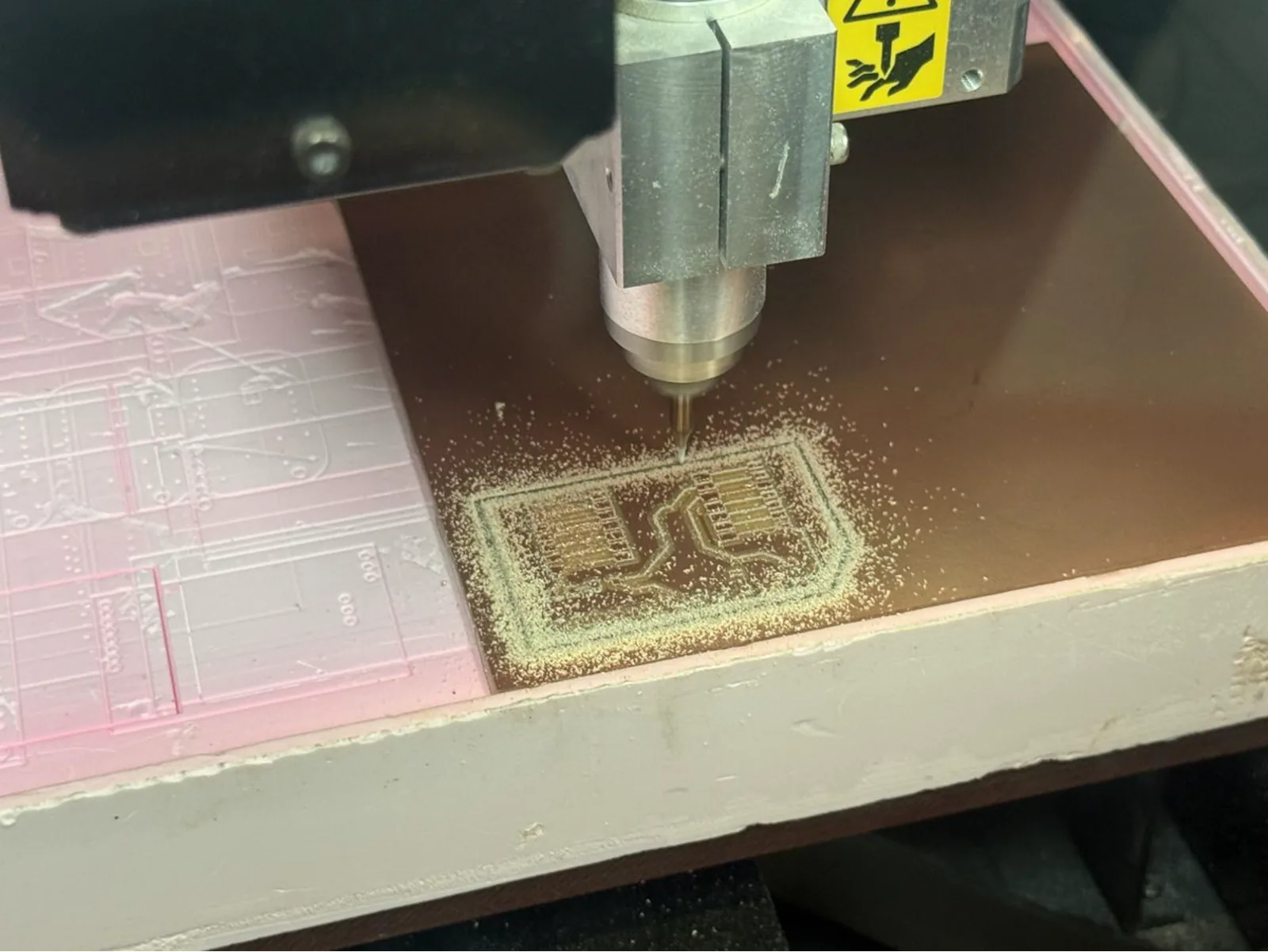 Milling nearing completion – the full Yaroboard circuit layout is clearly visible on the copper surface