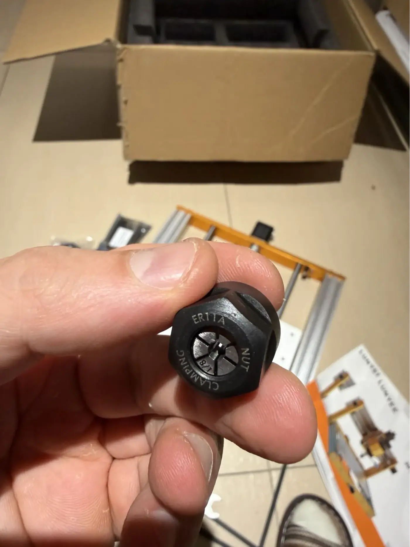 Close-up of the ER11A clamping nut showing the text and locking thread detail