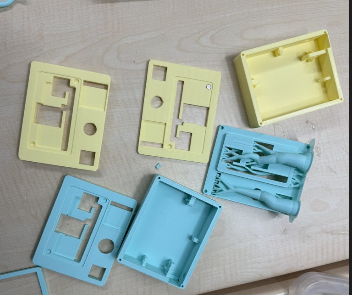 Printed top and body variants — blue vs yellow encoder clearance experiments