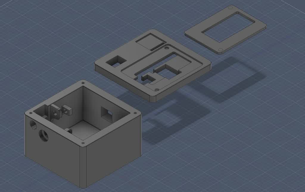 Version 2 enclosure — assembled yellow body with e-ink module fitted