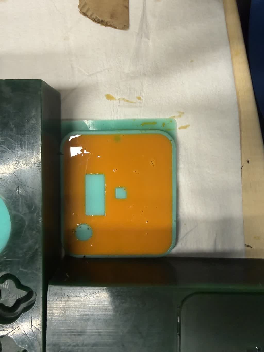Pouring orange casting resin into the Feyncorder top silicone mold