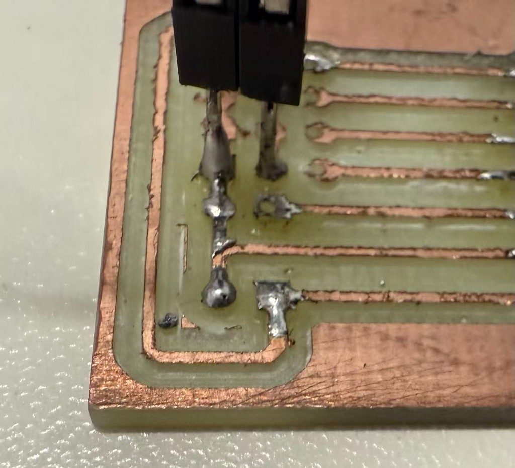 Close-up of trace damage from overheating during soldering