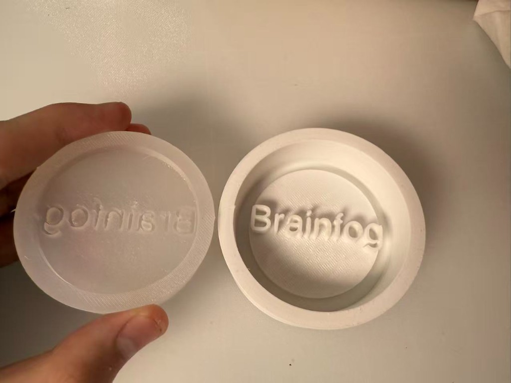 Silicone negative mold next to the printed master