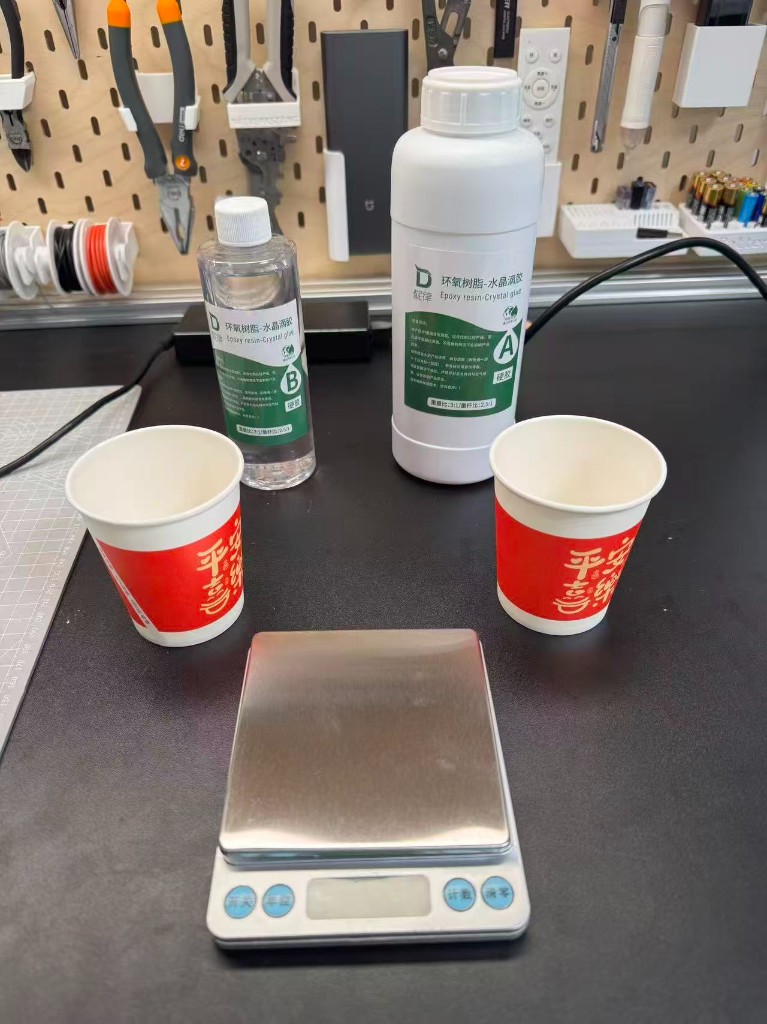 Epoxy resin A and B bottles and scale