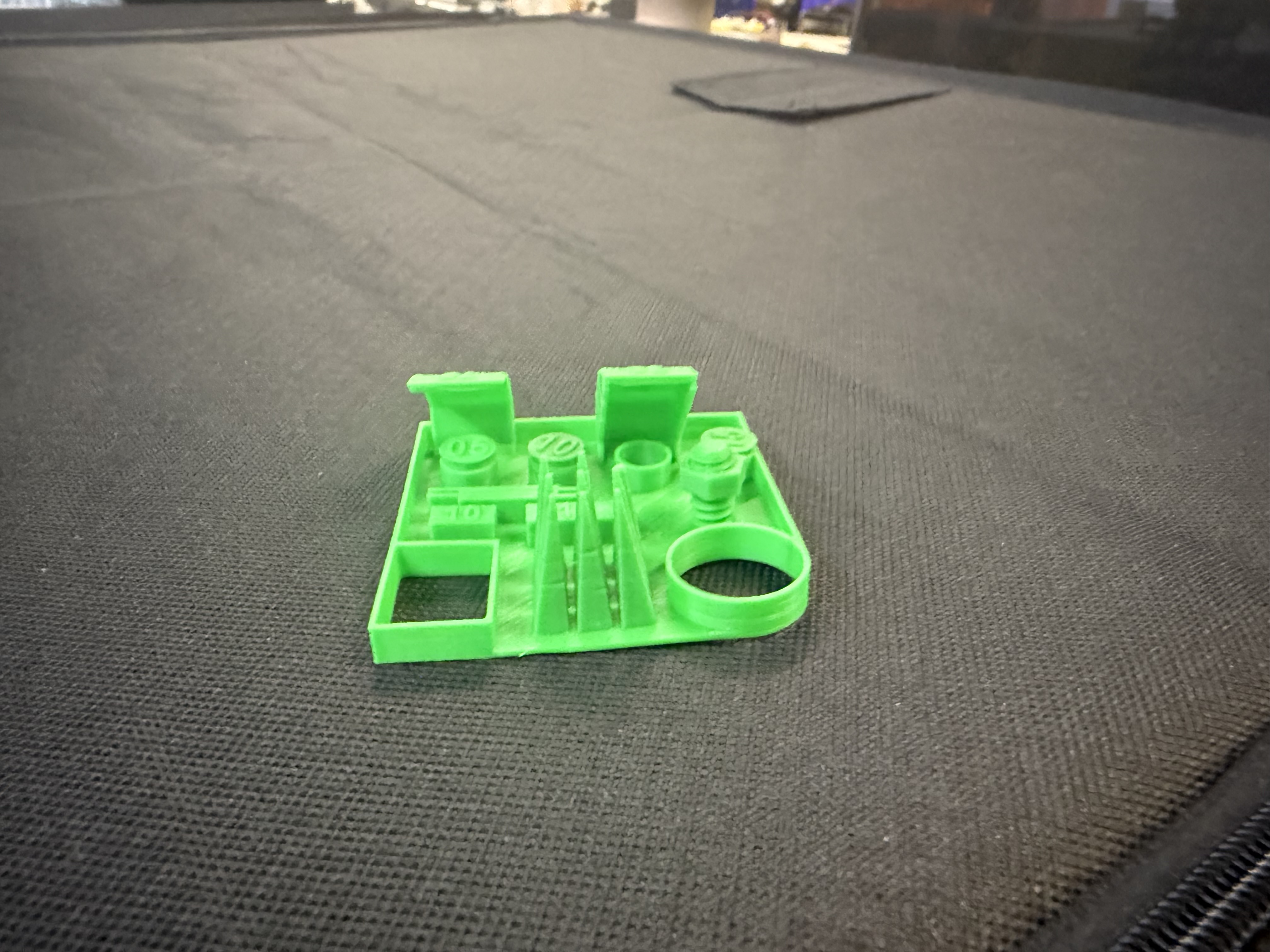 3D-printed design-rules test coupons on a build plate