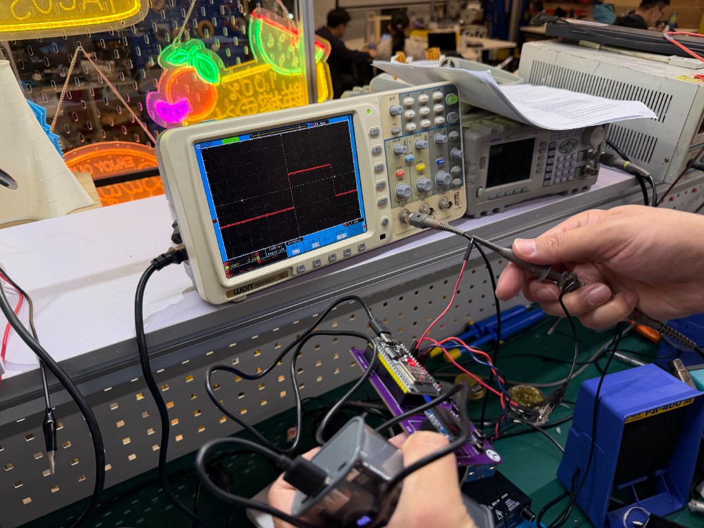 OWON oscilloscope with USB-powered ESP32 board
