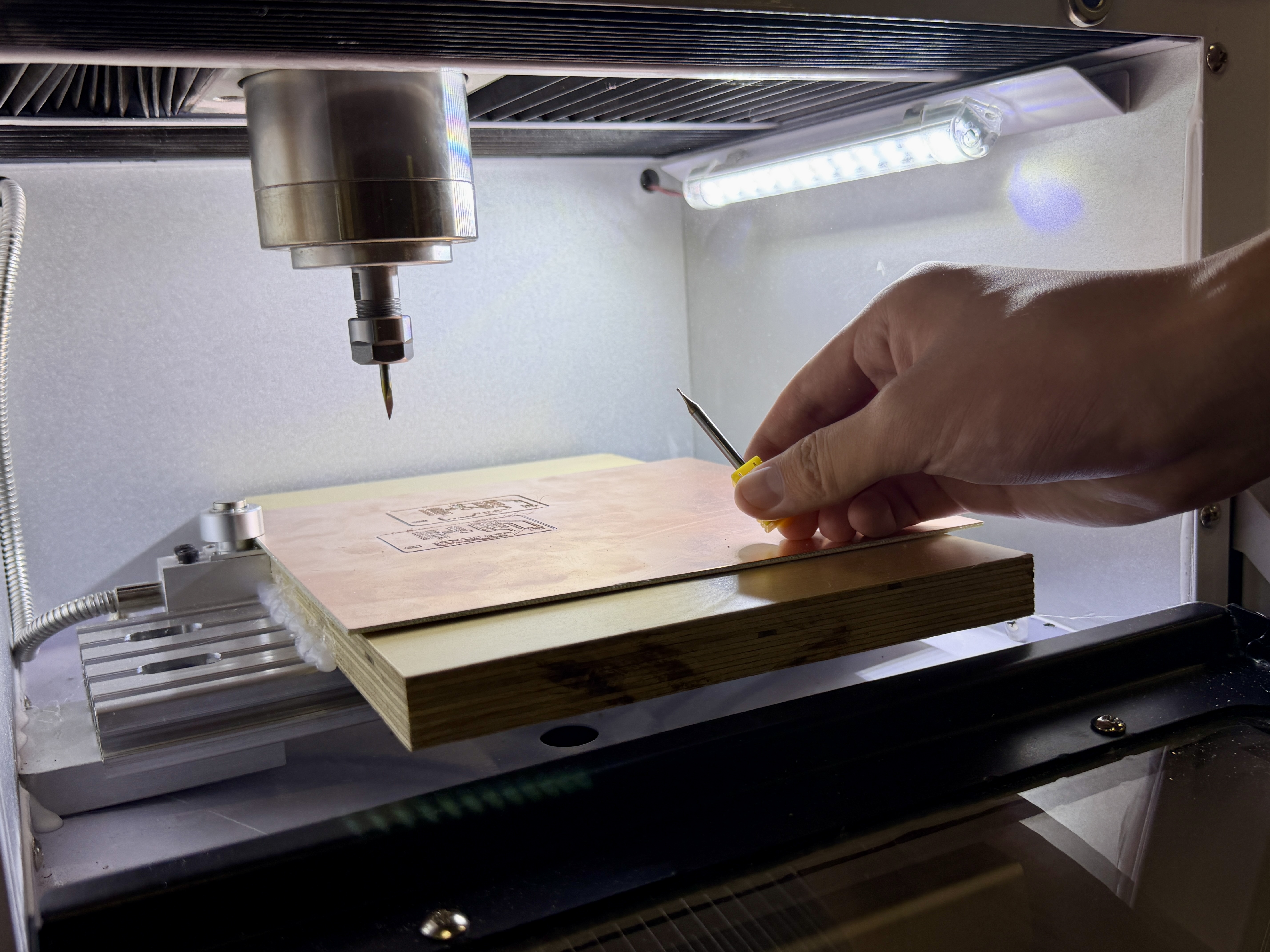 Side-by-side comparison of milling and cutting tool heads for PCB work