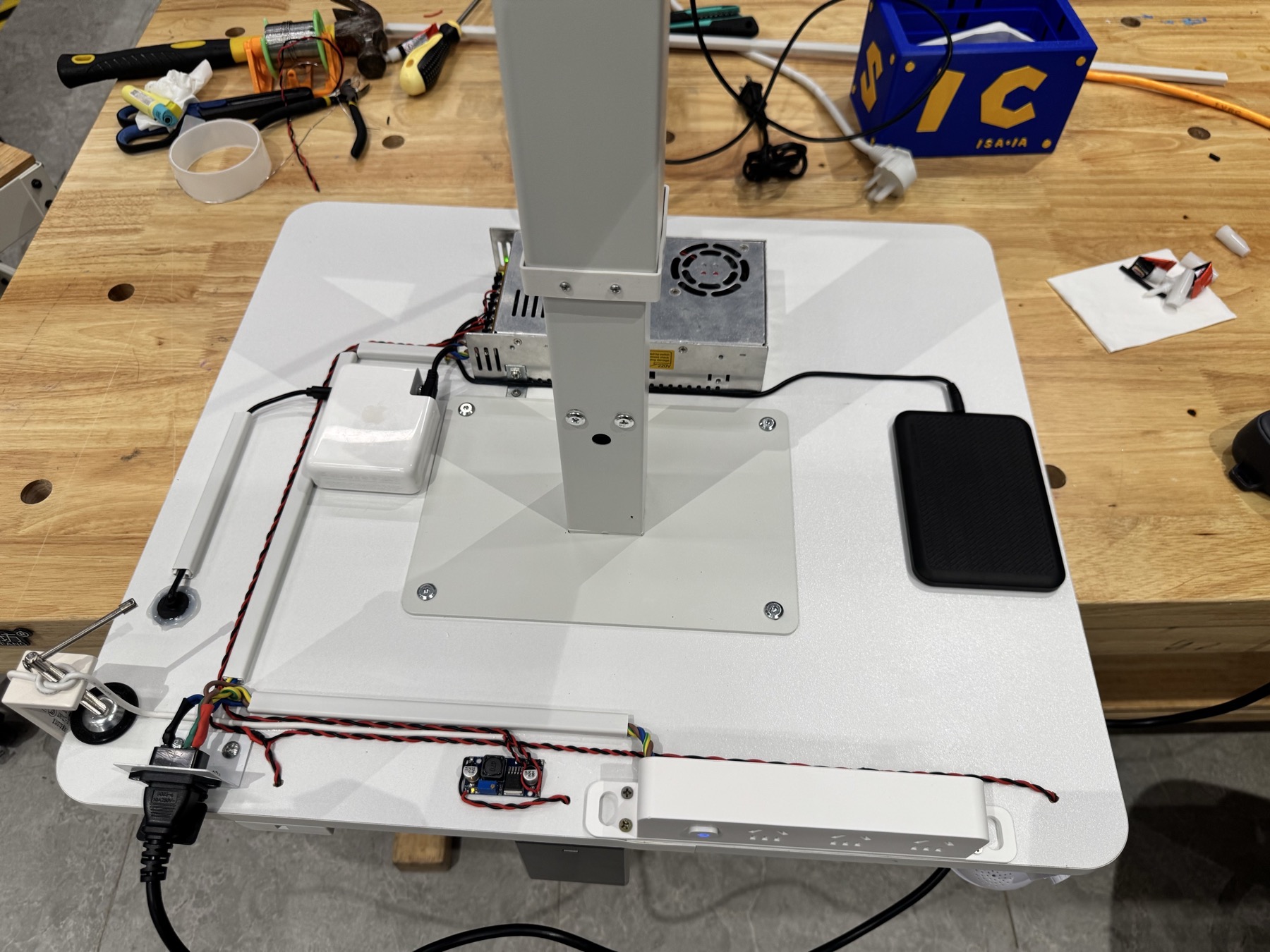 Bottom view showing PSU, wireless charger, and full wiring layout