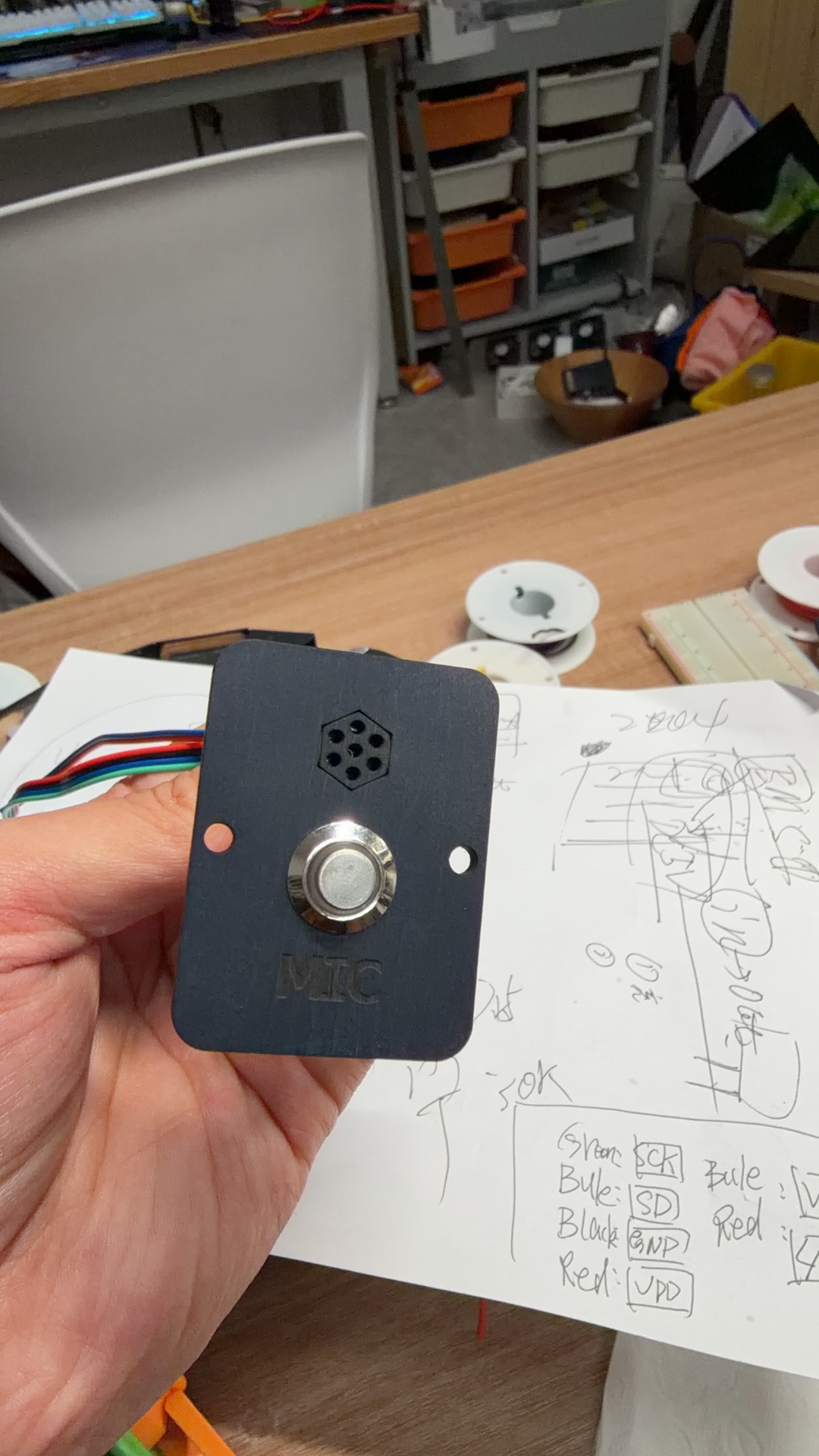 Spray-painted panel with microphone, wake button, and LED ring installed