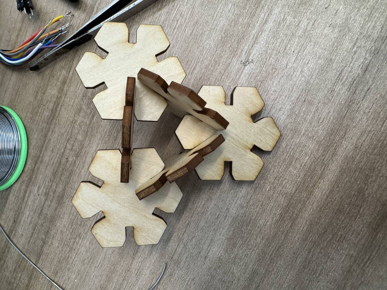 Finished 3D laser-cut snowflake construction kit standing assembled