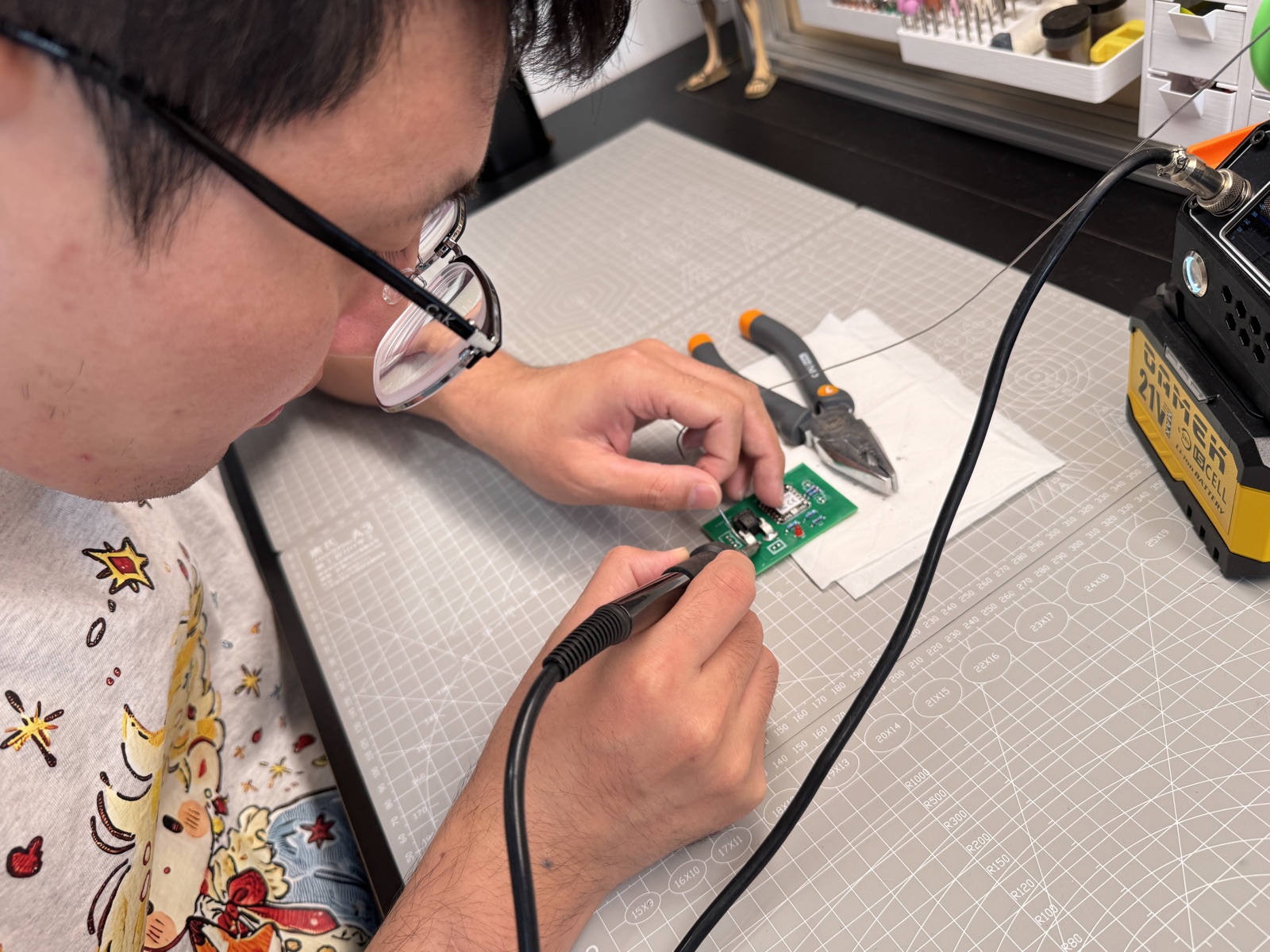 Hand soldering Seeed XIAO RP2040 onto the charging dock PCB