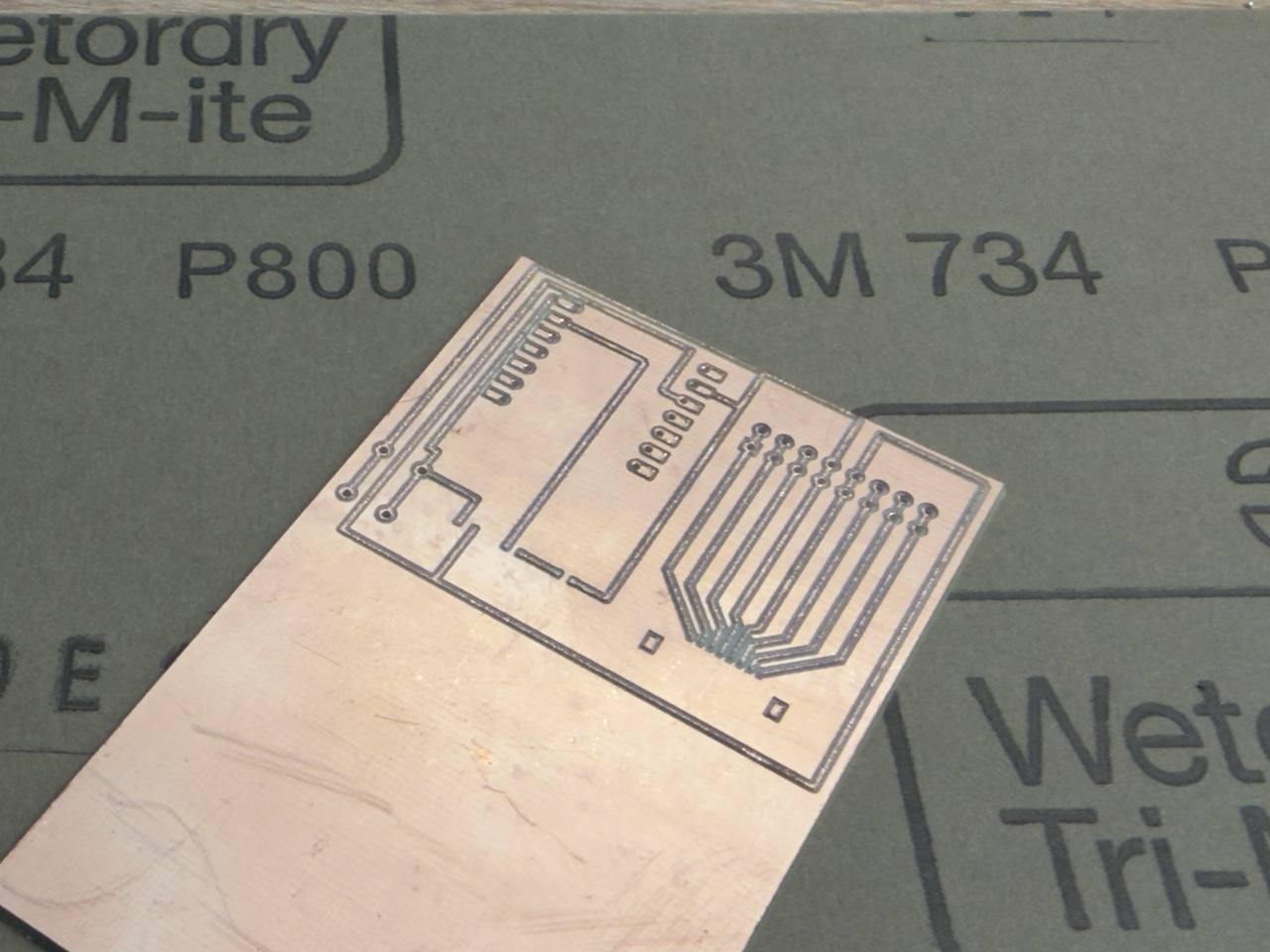 Milled PCB with visible copper burrs between traces before sanding