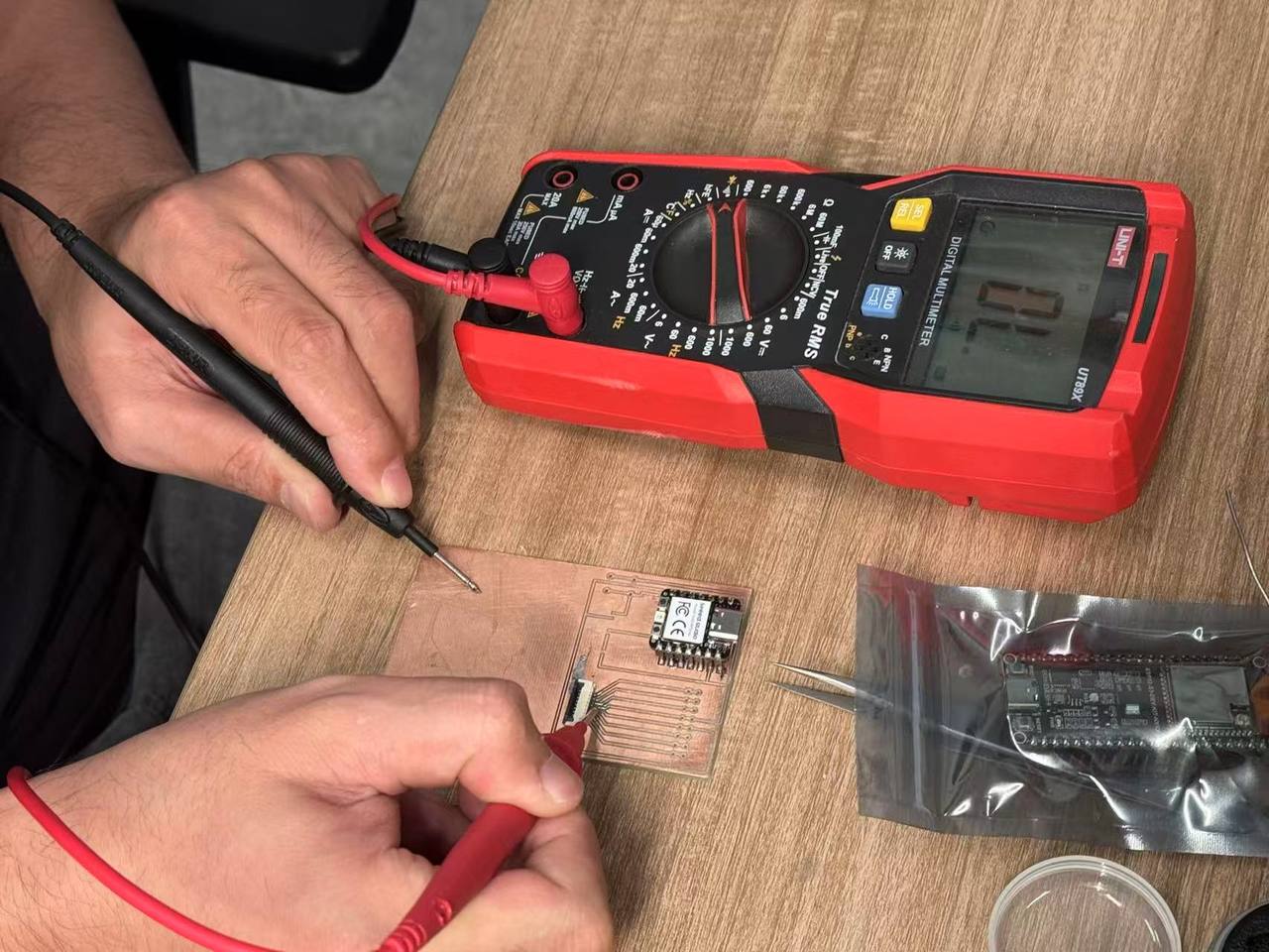 Multimeter continuity check at the FPC connector pads