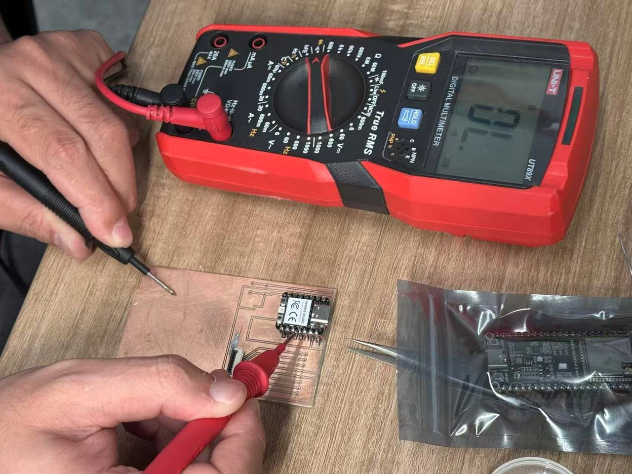 Multimeter continuity check between XIAO pads and PCB copper