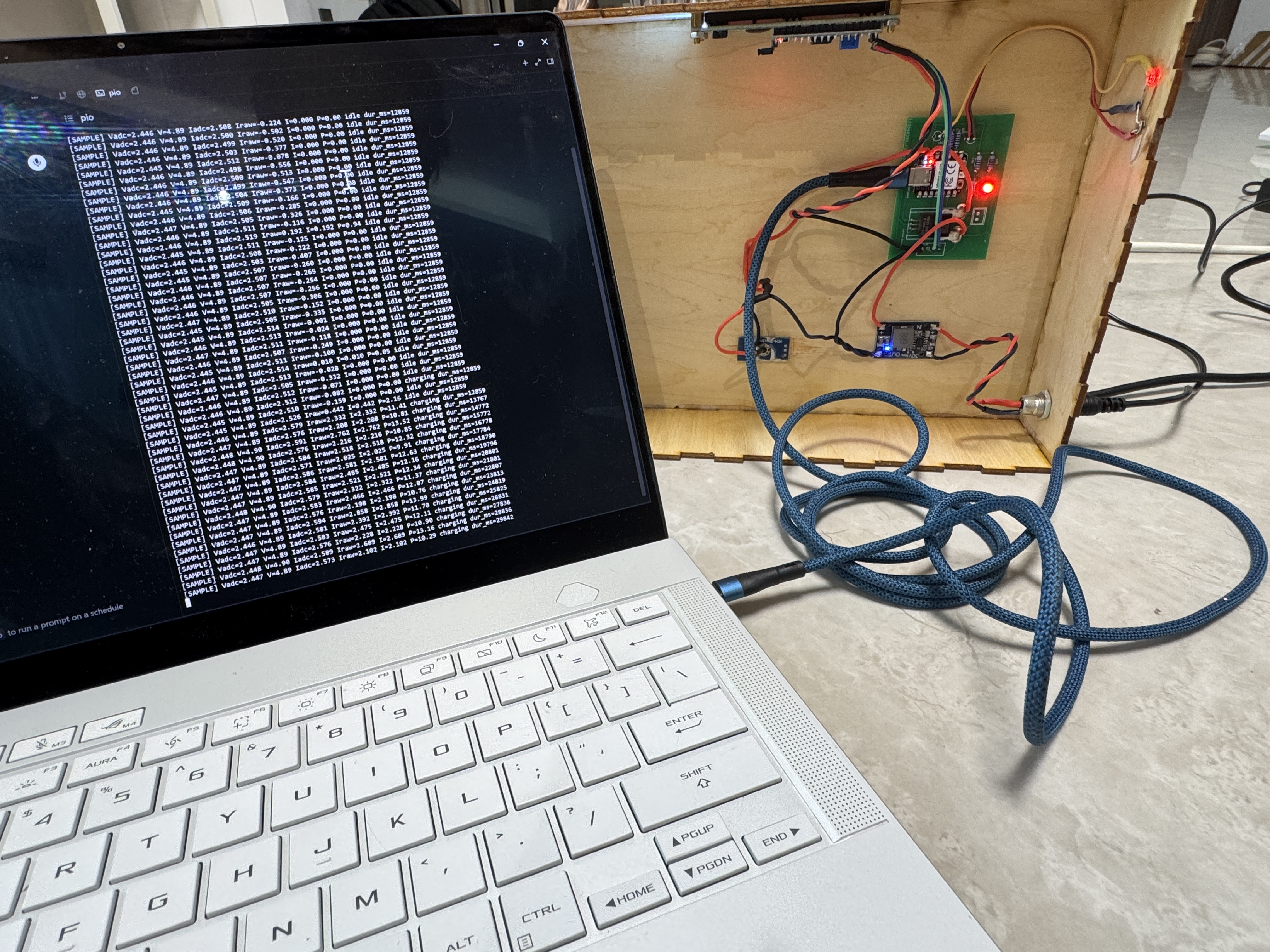 Serial monitor showing voltage current power and charge duration from the dock firmware