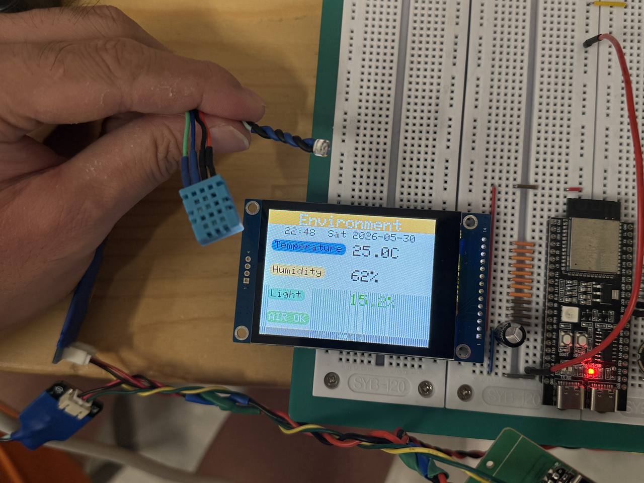 OLED screen showing humidity temperature and light level readings