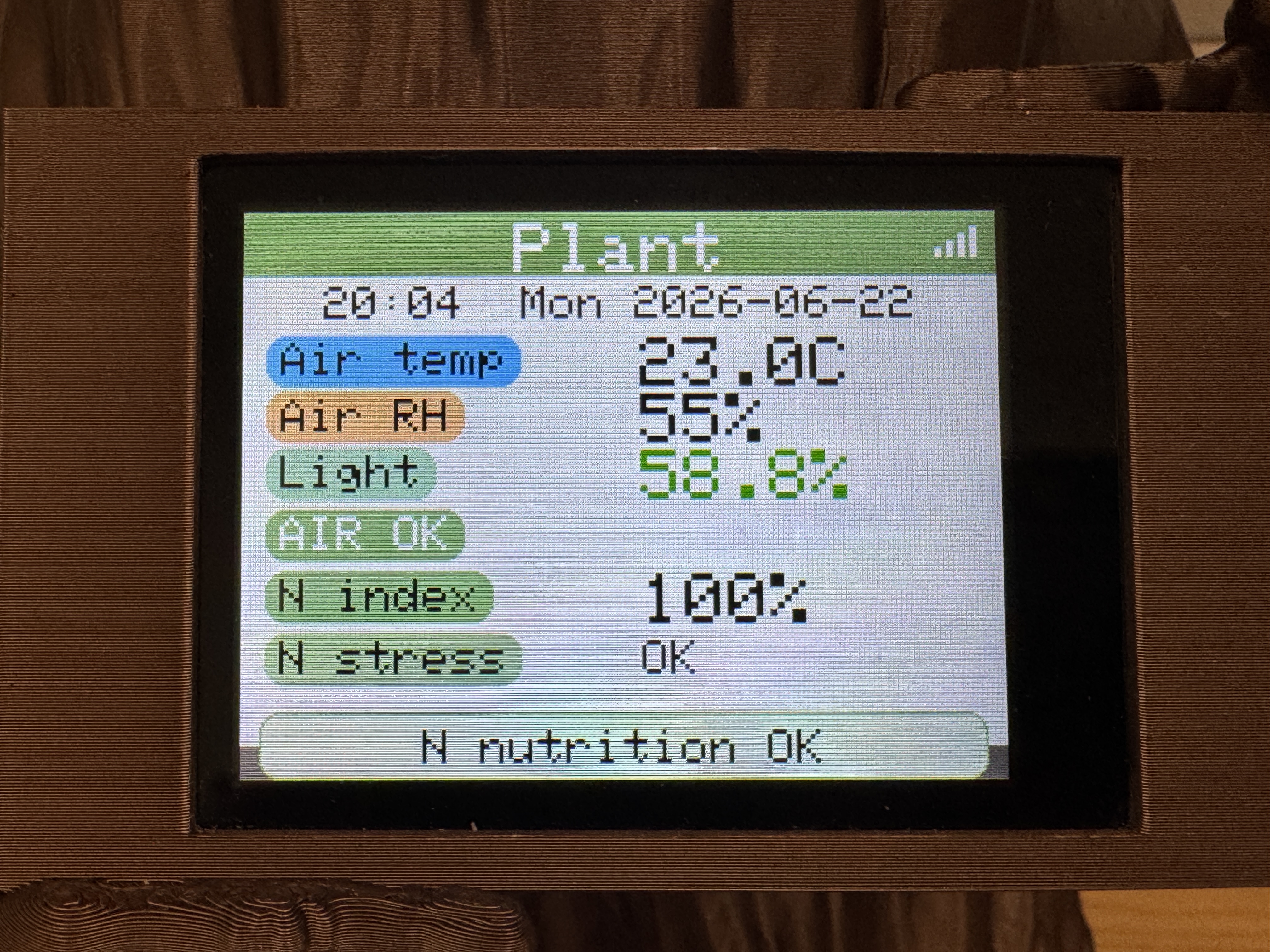 Plant info screen showing humidity, temperature, and light readings