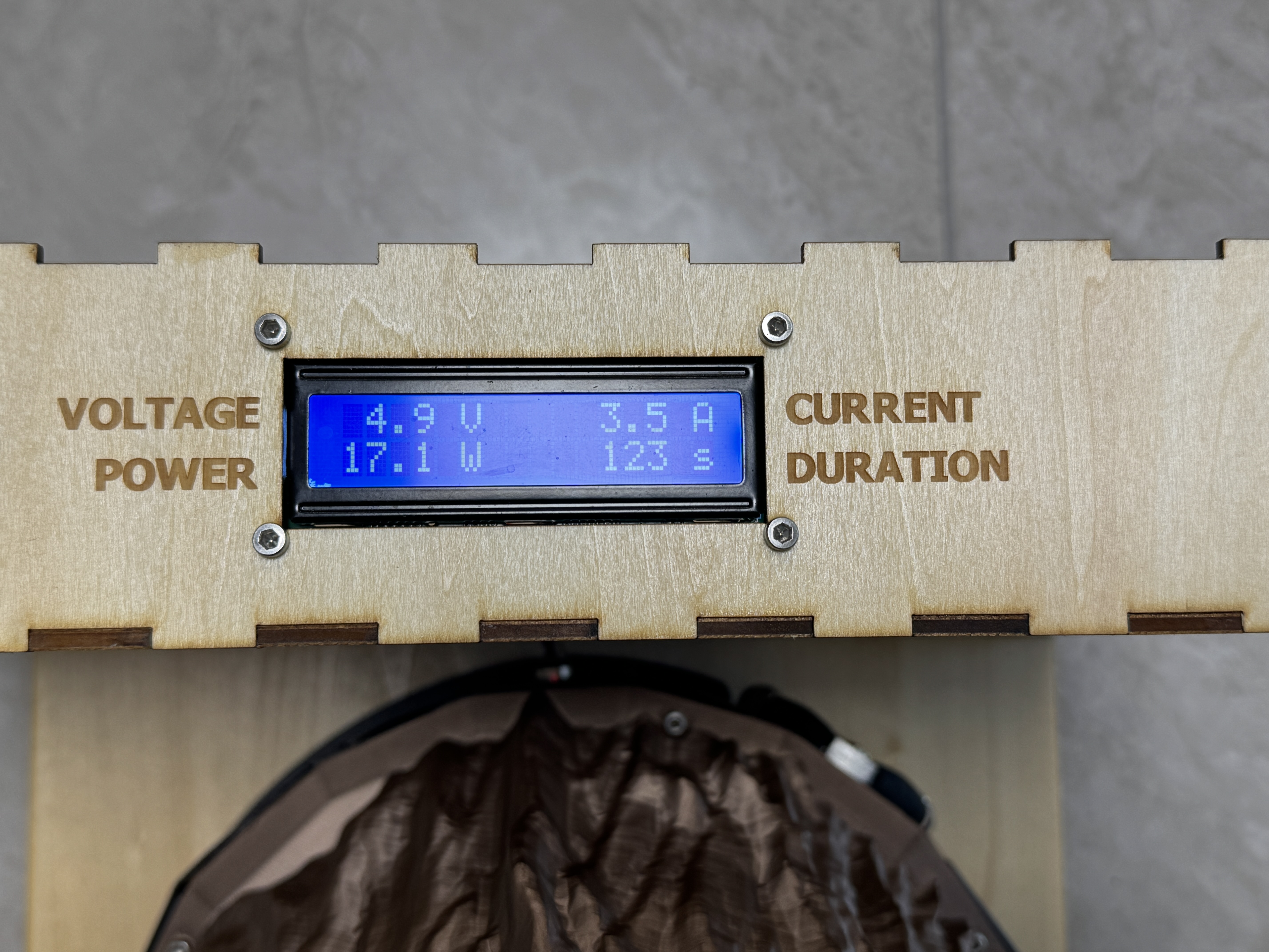 1602 LCD on the charging dock showing voltage, current, power, and charge duration