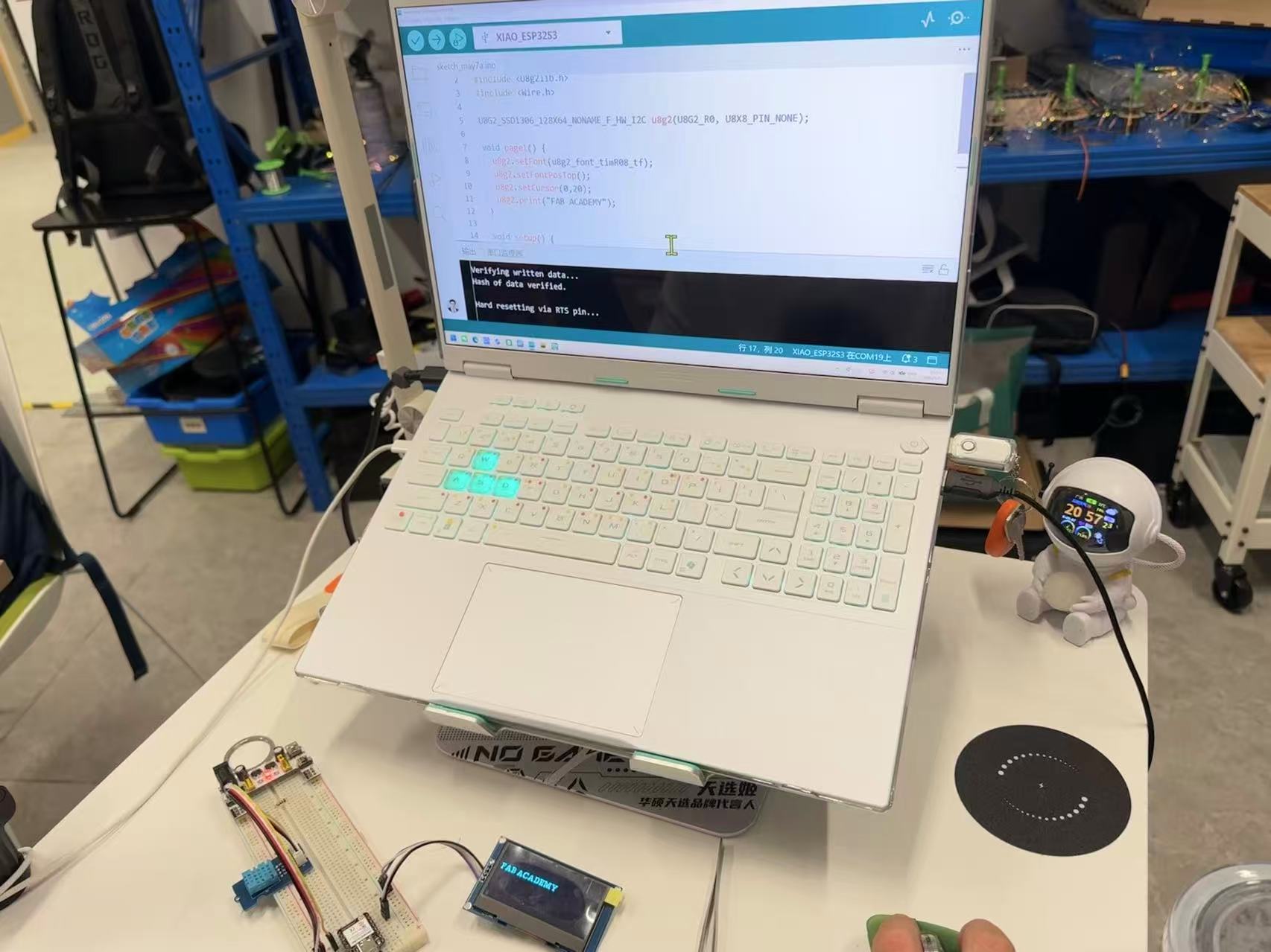 OLED display showing Fab Academy text test pattern