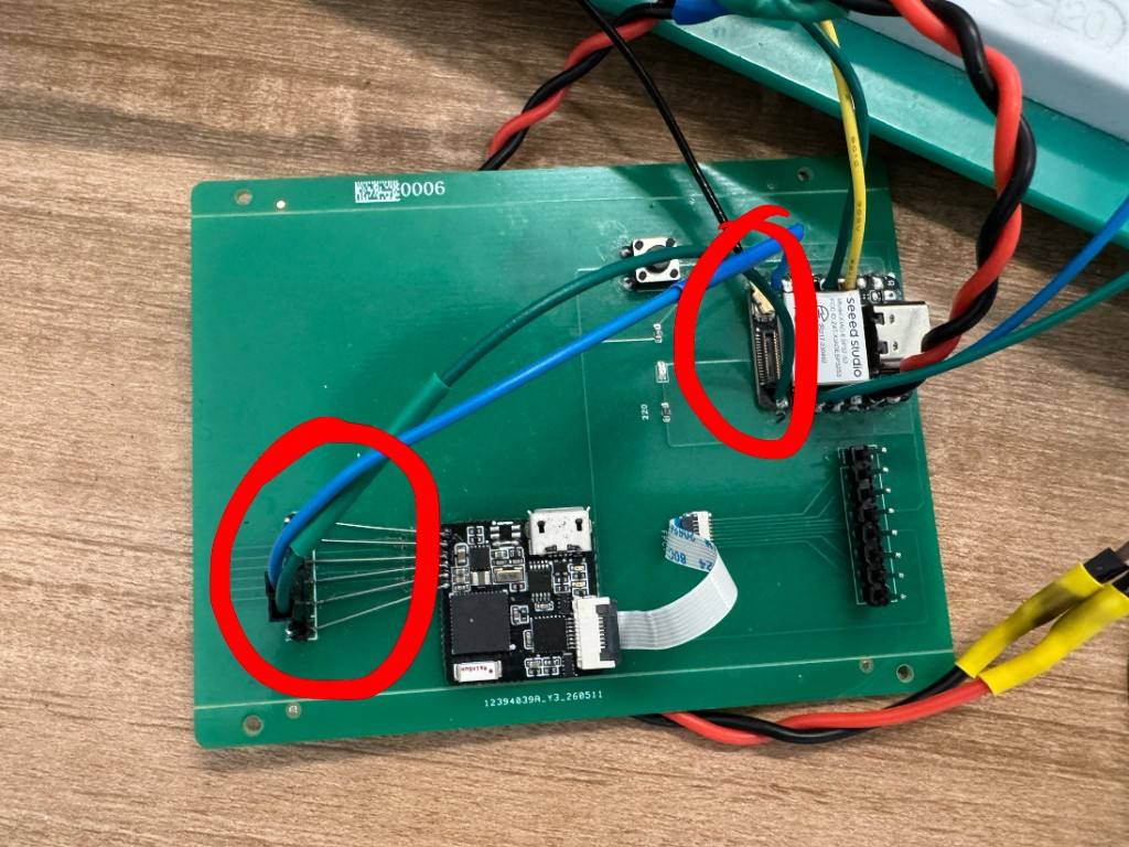 Week 8 carrier PCB with Seeed XIAO ESP32-S3 and ESP32 Pico NanoStat module connected by blue and green UART wires