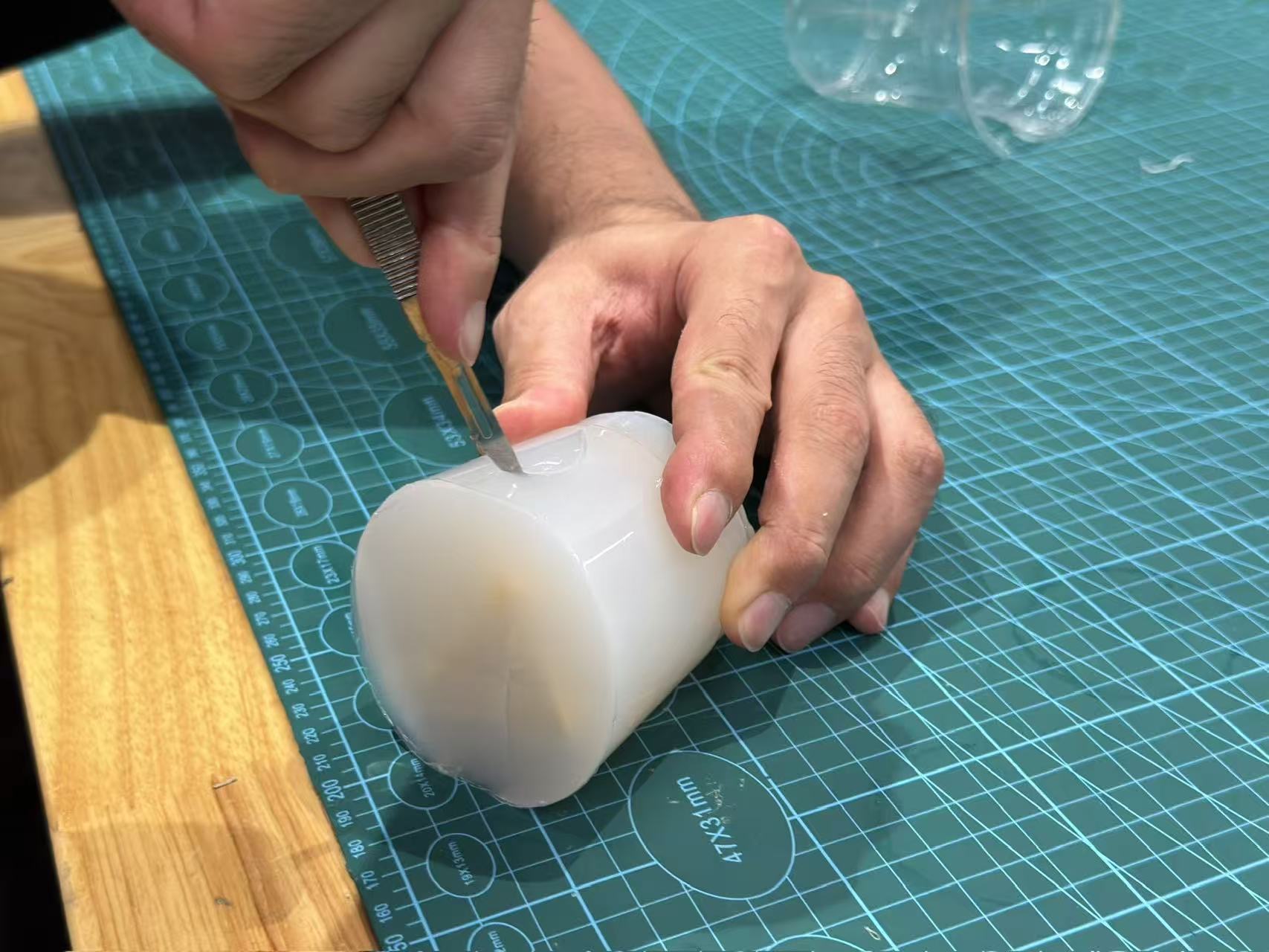 Cutting the cured silicone along a serpentine path