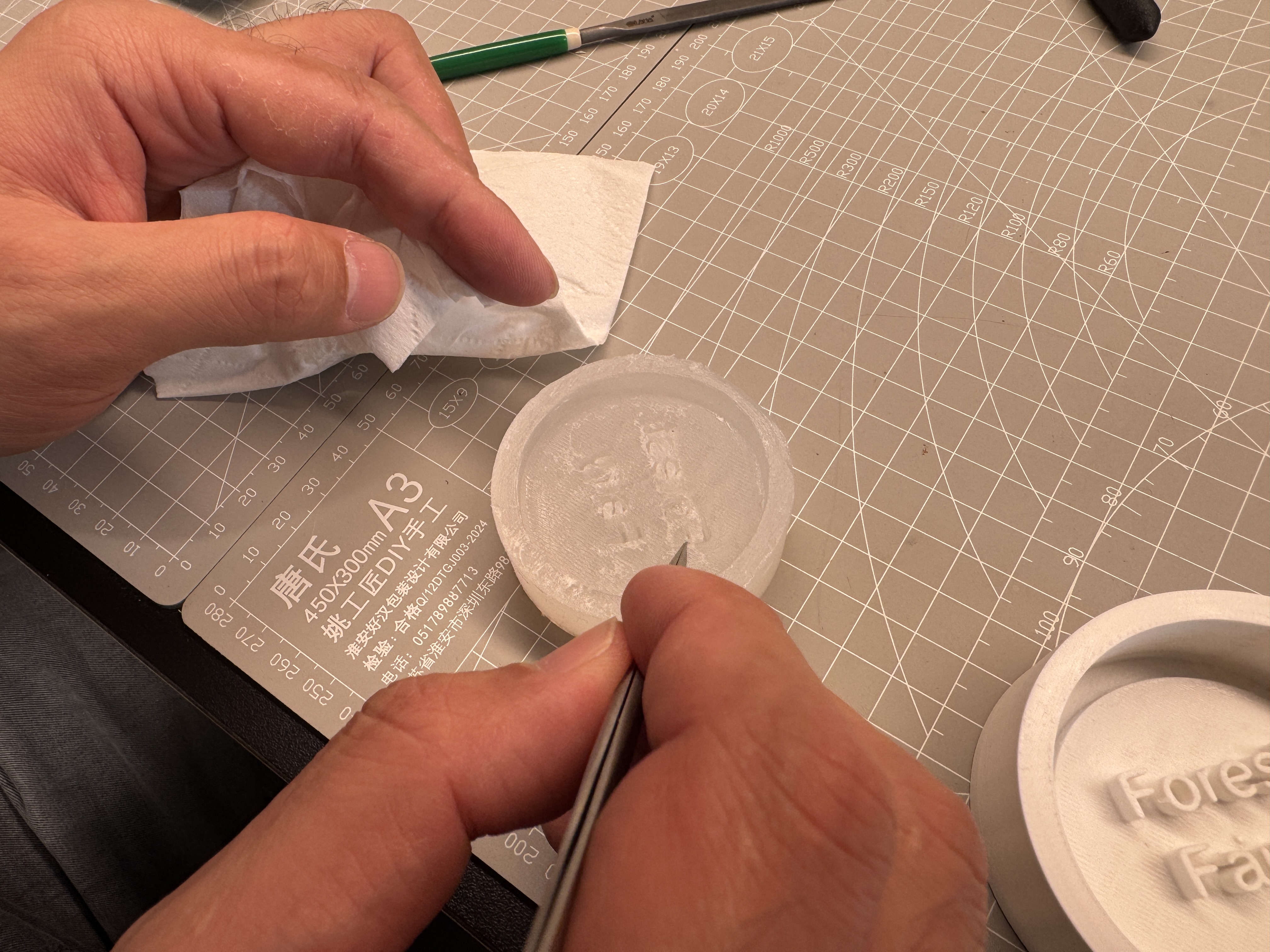 Cleaning the surface of the forest fairy silicone mold with tweezers
