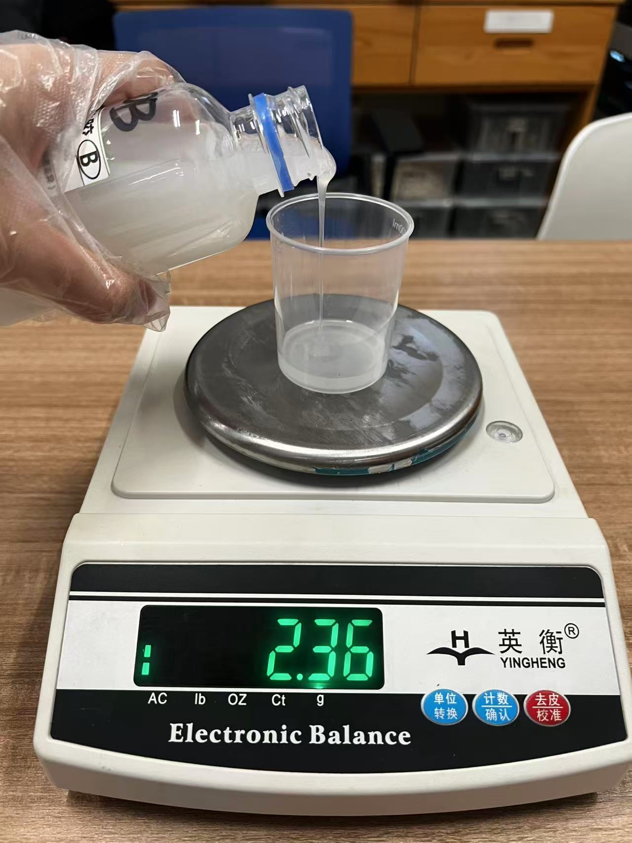 Silicone A and B components on a scale