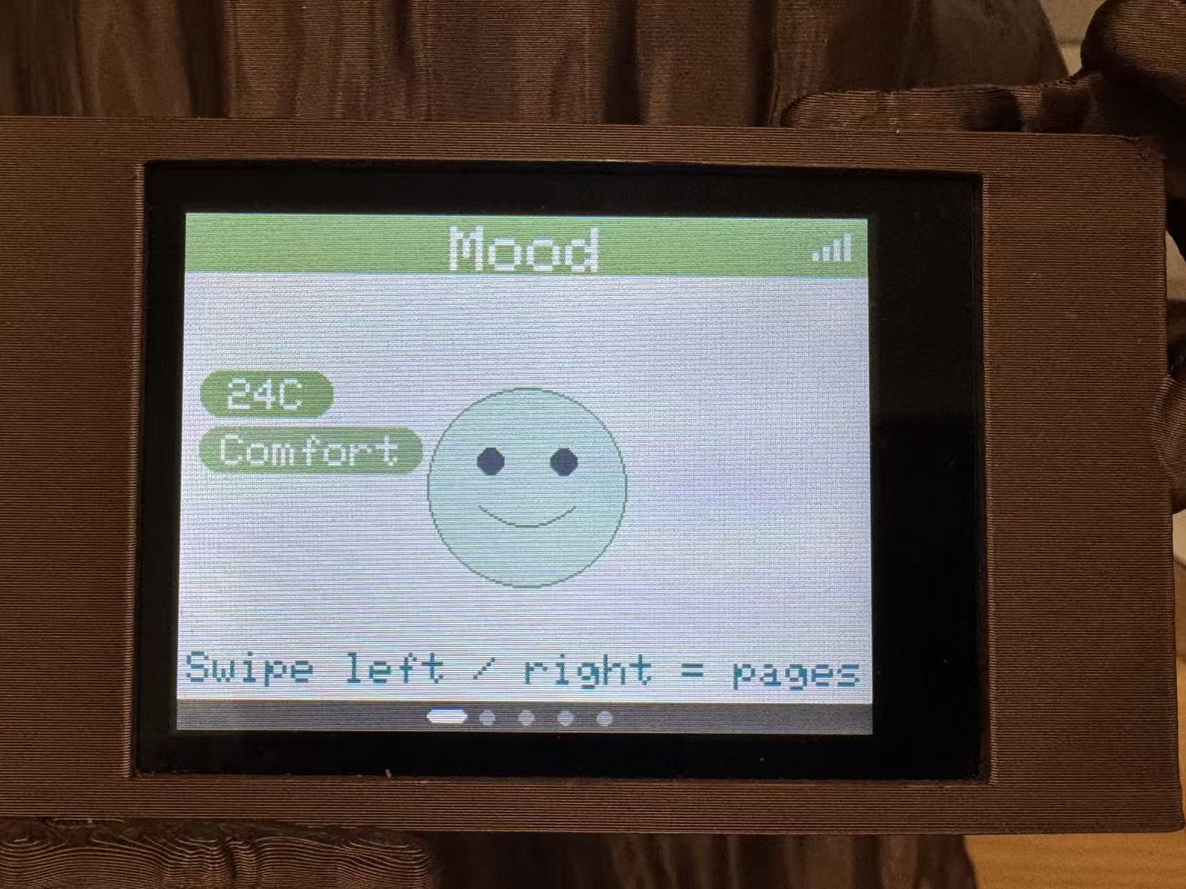 MOOD page on the ILI9341 TFT — temperature emoji face driven by hub telemetry