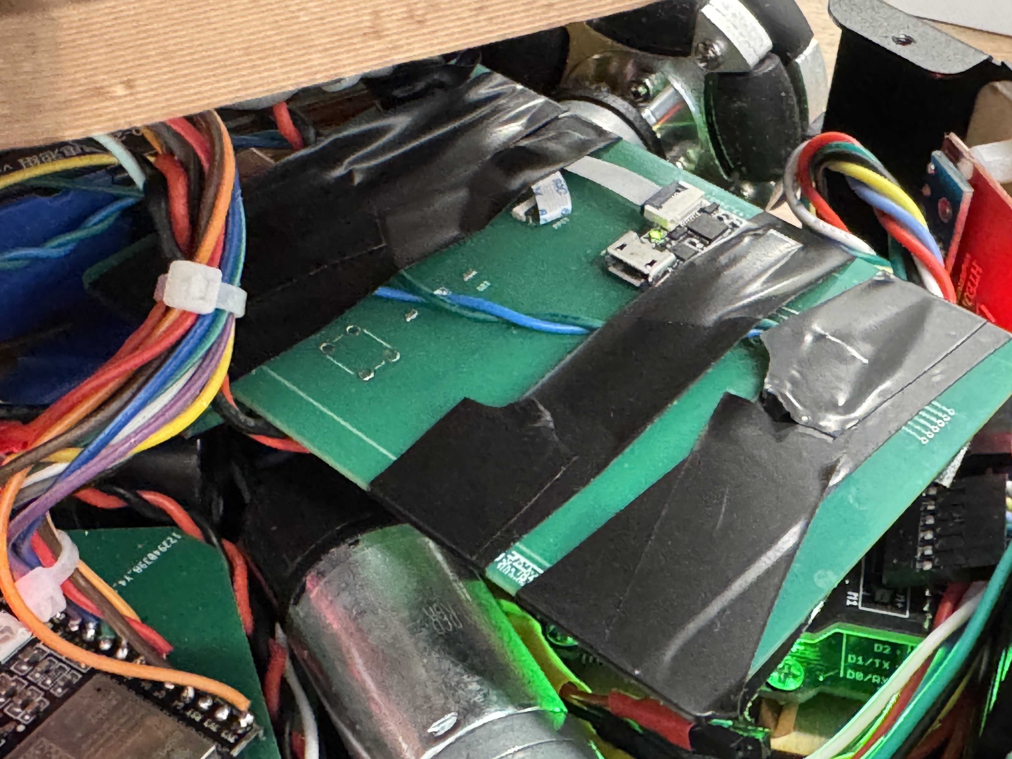 Pico XIAO board packaged with electrical tape inside the Forest Fairy body