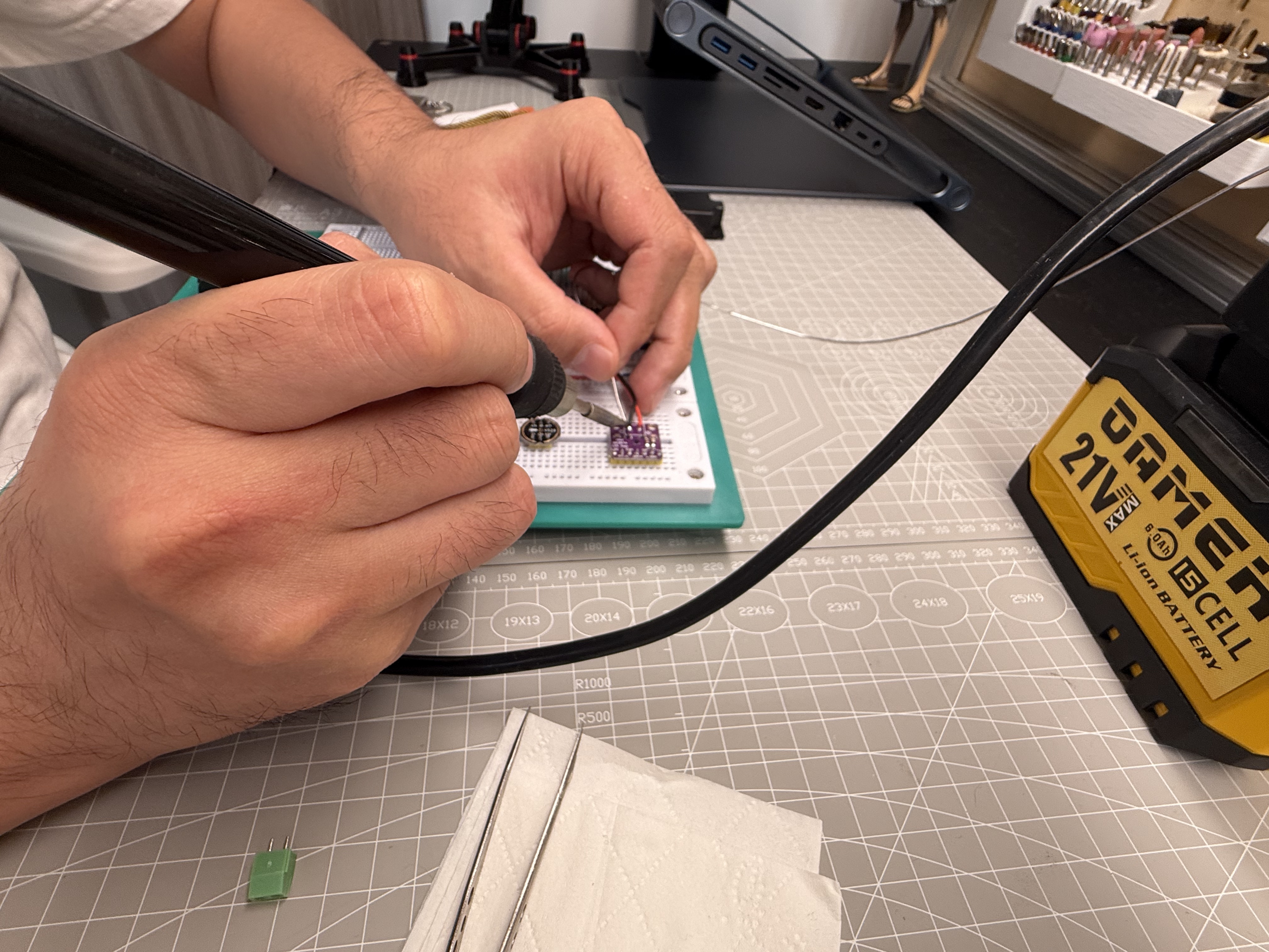 Soldering header pins onto the I2S microphone module for a stable bench connection