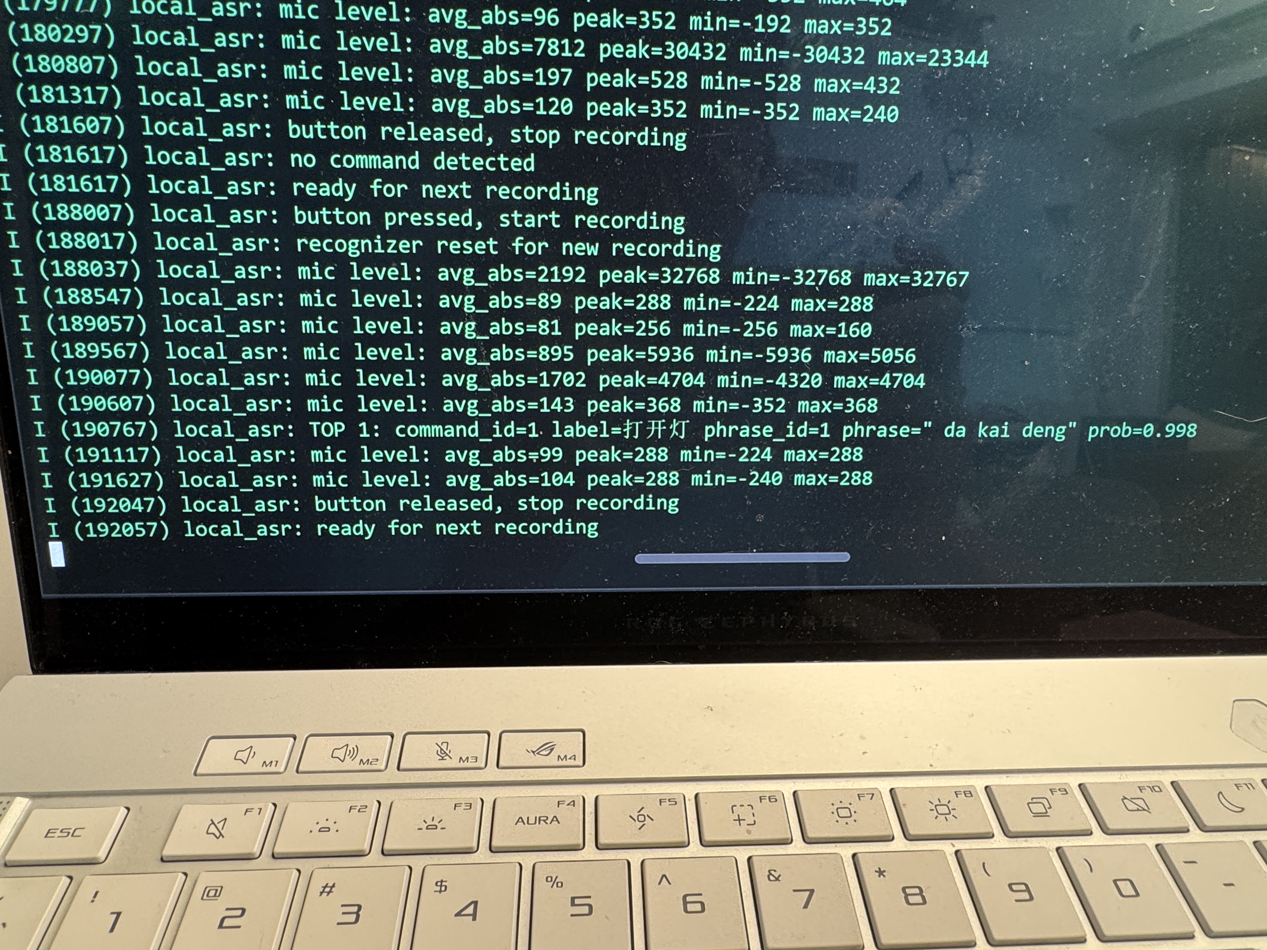 Serial monitor showing successful local command recognition with command_id, label, and probability